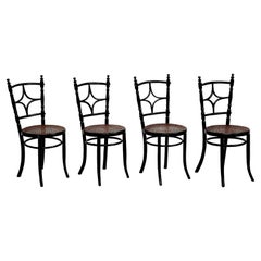 Satz von vier rustikalen französischen Stühlen aus Holz, um 1950