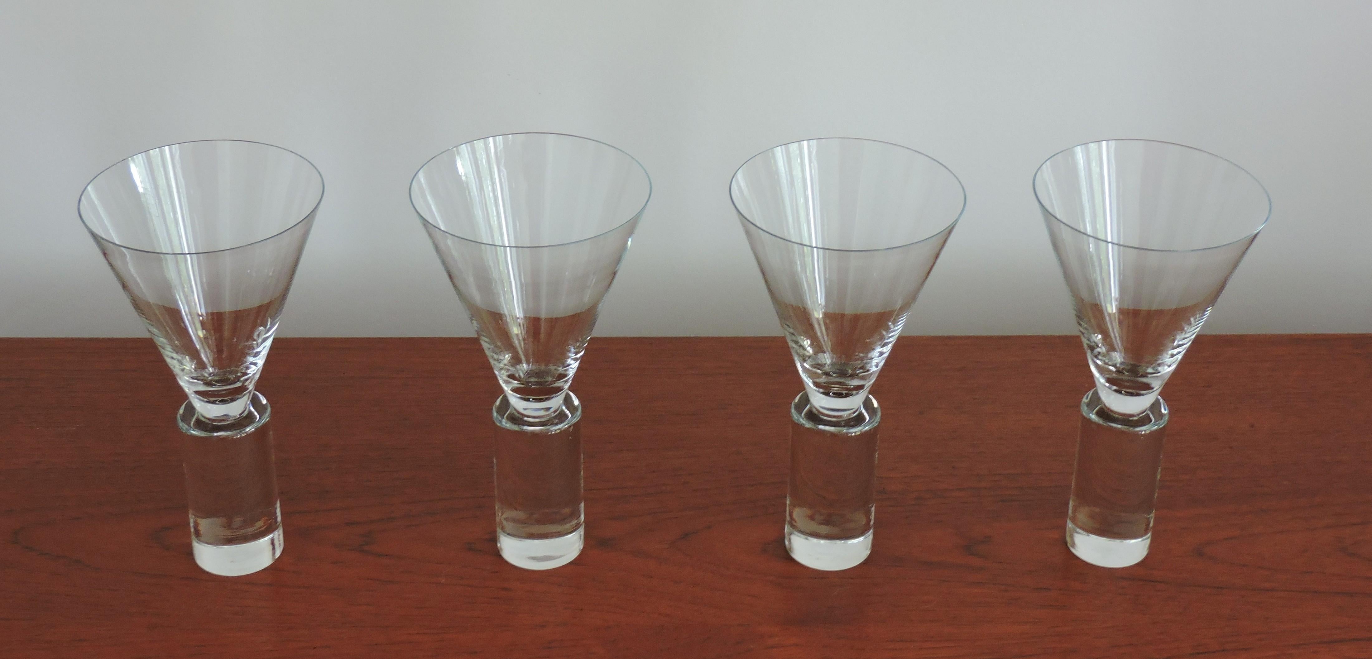 Beautiful set of four drinking glasses manufactured by Toyo Sasaki Glass Company of Japan. These glasses are in the Colonnade pattern and are made of handblown high quality crystal with an elegant, modern shape. Manufactured from 1995-2005, now