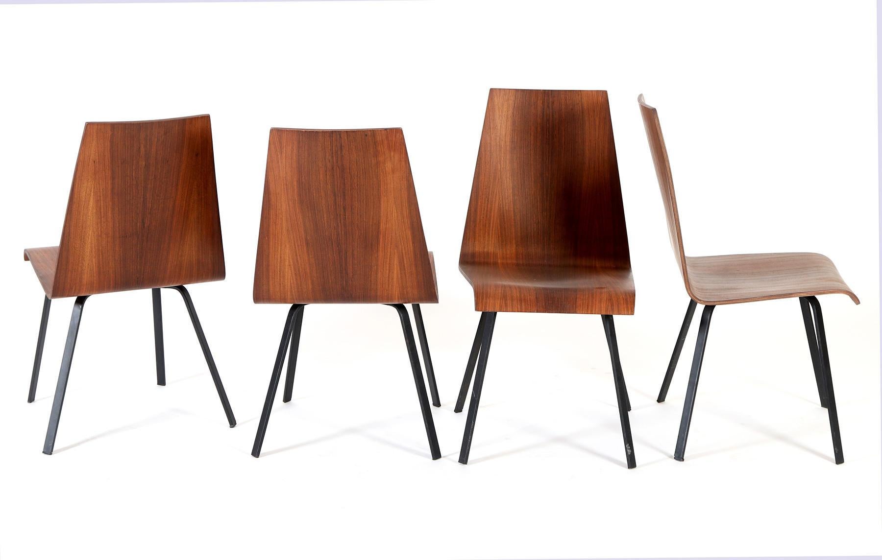 Steel frame black painted with hardwood plywood seat/backrest made in Sweden in the late 1960s.
Set of four, one with small damage on the corner (see picture).