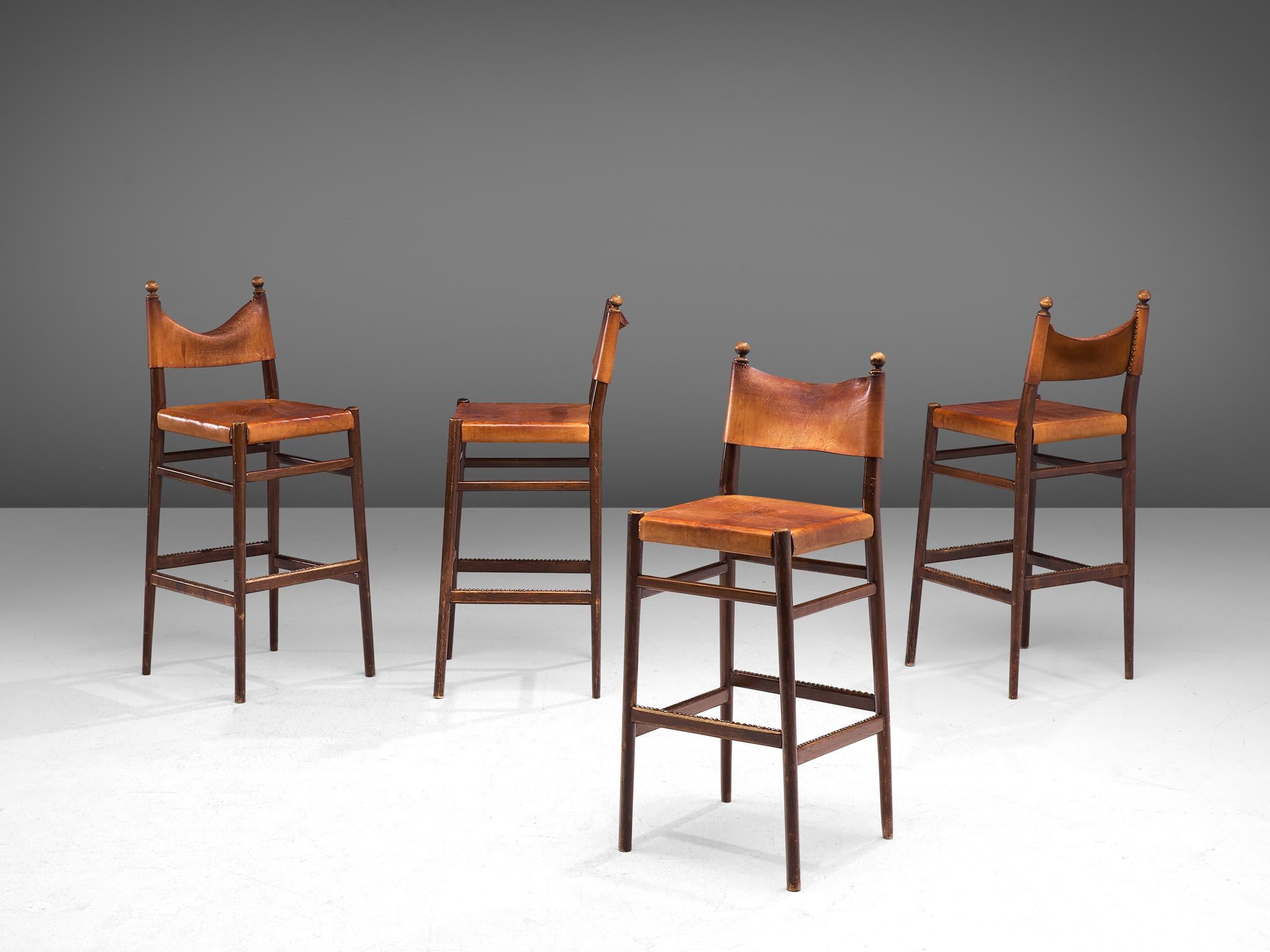 Set of 4 barstools, patinated leather, brass and oak, Scandinavia, 1960s.

Exquisite set of Scandinavian Modern high chairs. The frame is slim and the conical shaped legs are flared positioned from each other. The horizontal slats that connect the