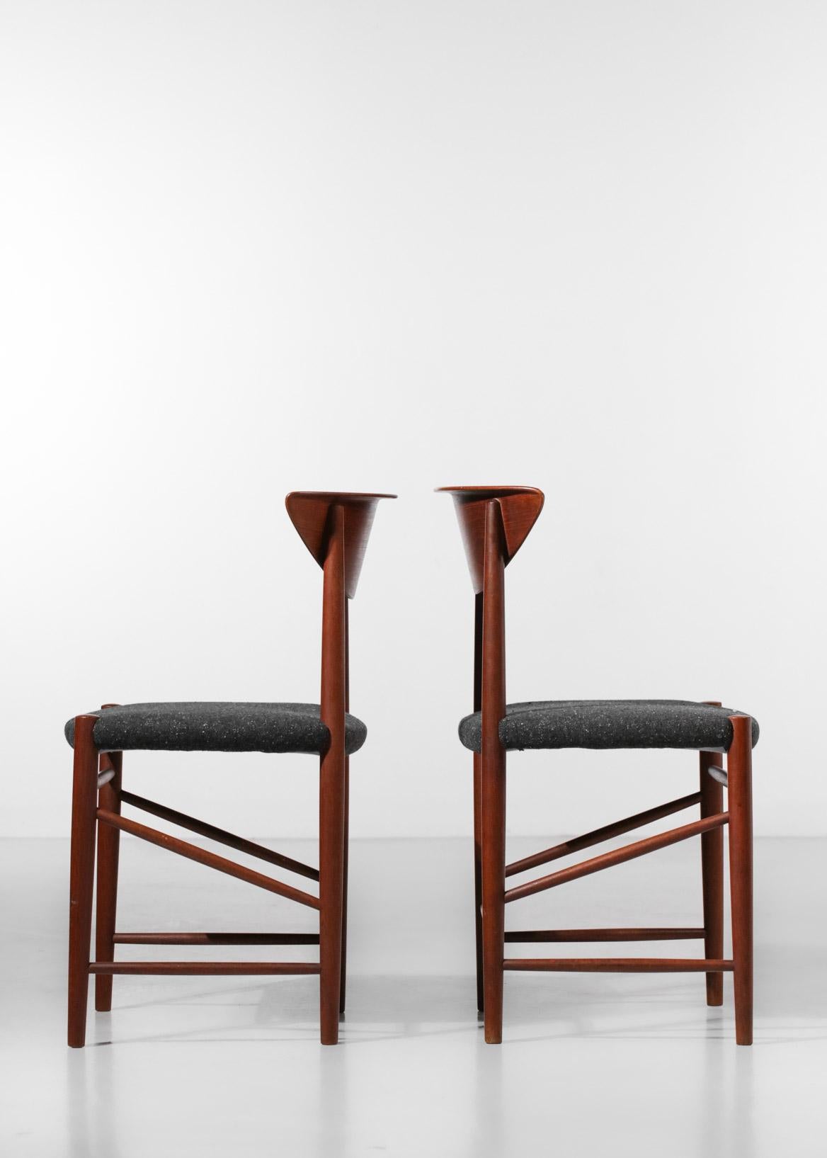 Set of four Scandinavian chairs by the famous Danish duo of designers Peter Hvidt and Orla Mølgaard Nielsen made in the 50s. Structure in solid teak, seats refurbished to measure in a dark gray wool. Iconic 