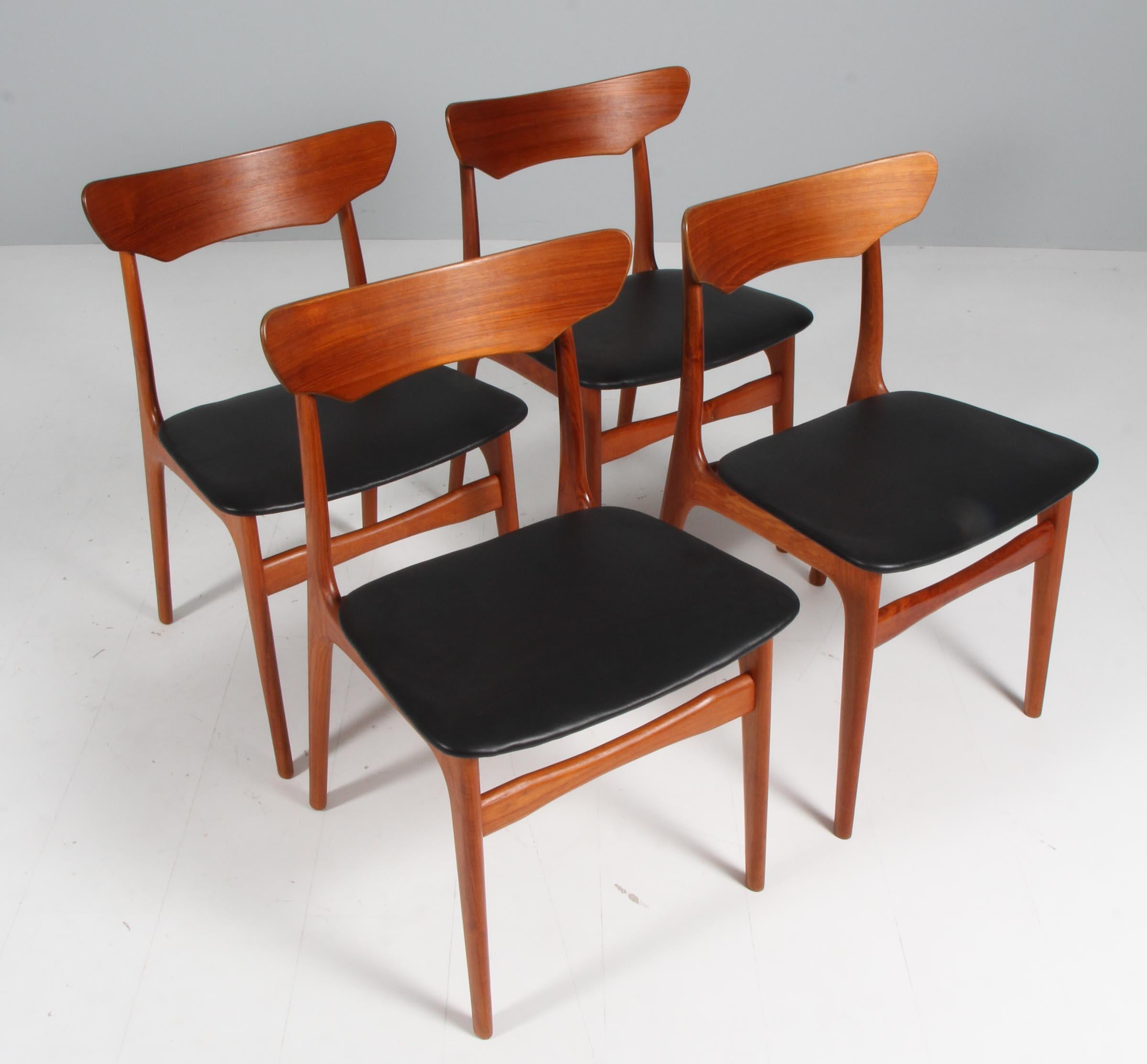 Set of four Schønning & Elgaard Dining chairs in partly solid teak.

New upholstered with black aniline leather.

