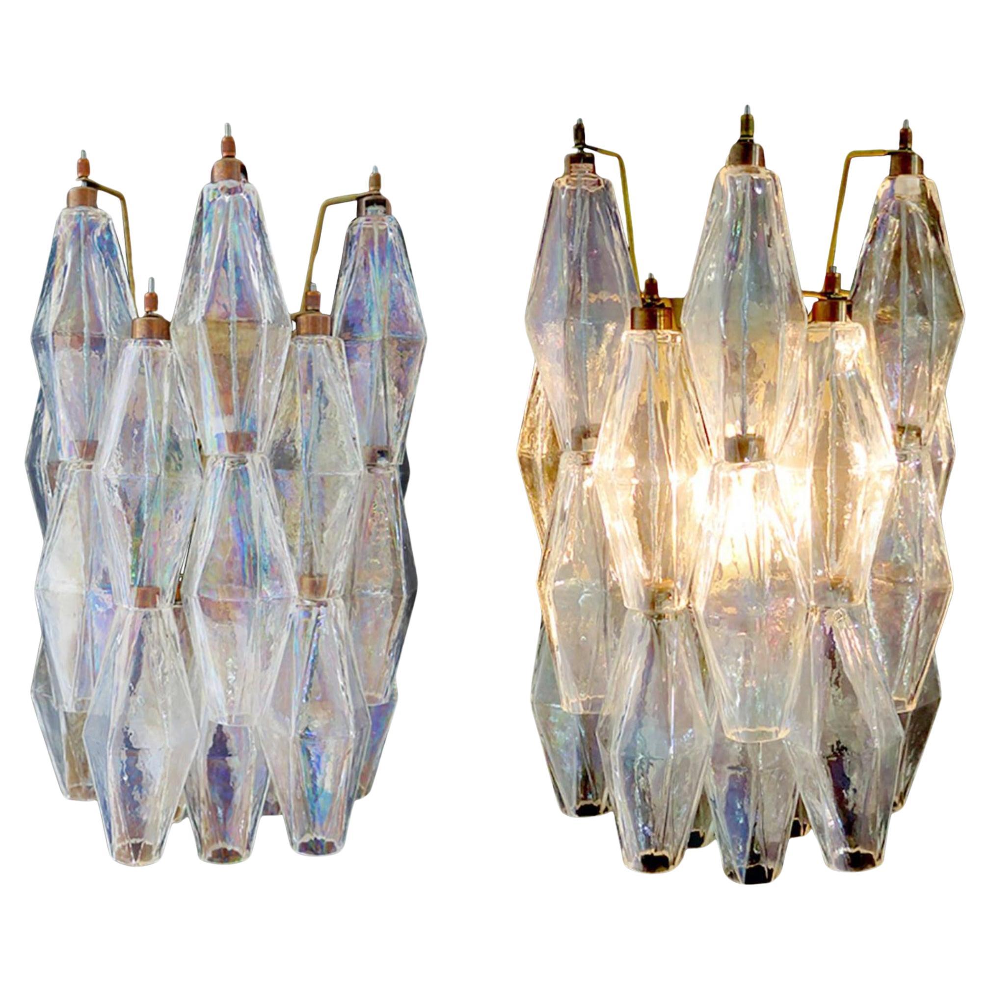 100% handmade in Murano. The sconces are made by 16 Murano handmade Poliedri glass, for each one, in a solid metal frame gold painted and brass. The glasses
are now unavailable, they have the particularity of reflecting a multiplicity of colors,