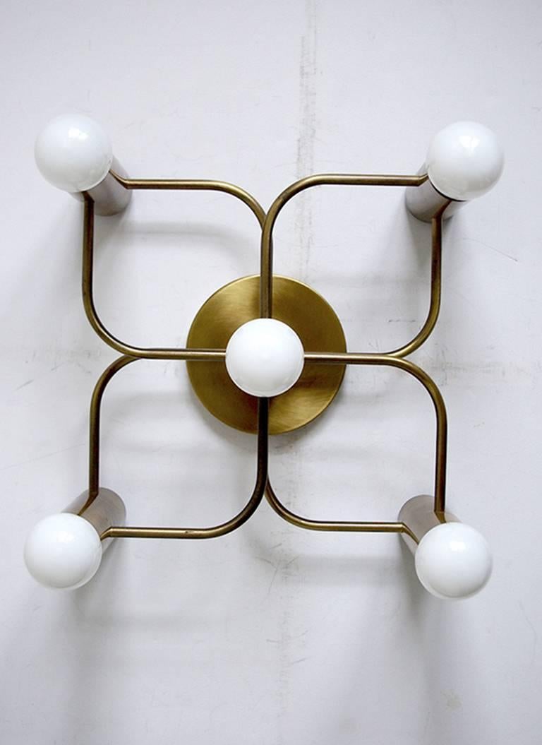 Set of four sculptural Sciolari style ceiling or wall flush mounts.
Germany, 1960s.
Measures: height 13.8 in, width 13.8 in, depth 7 in
Rare brushed brass version.
Lamp sockets: à 5x E27 (US E26).
 