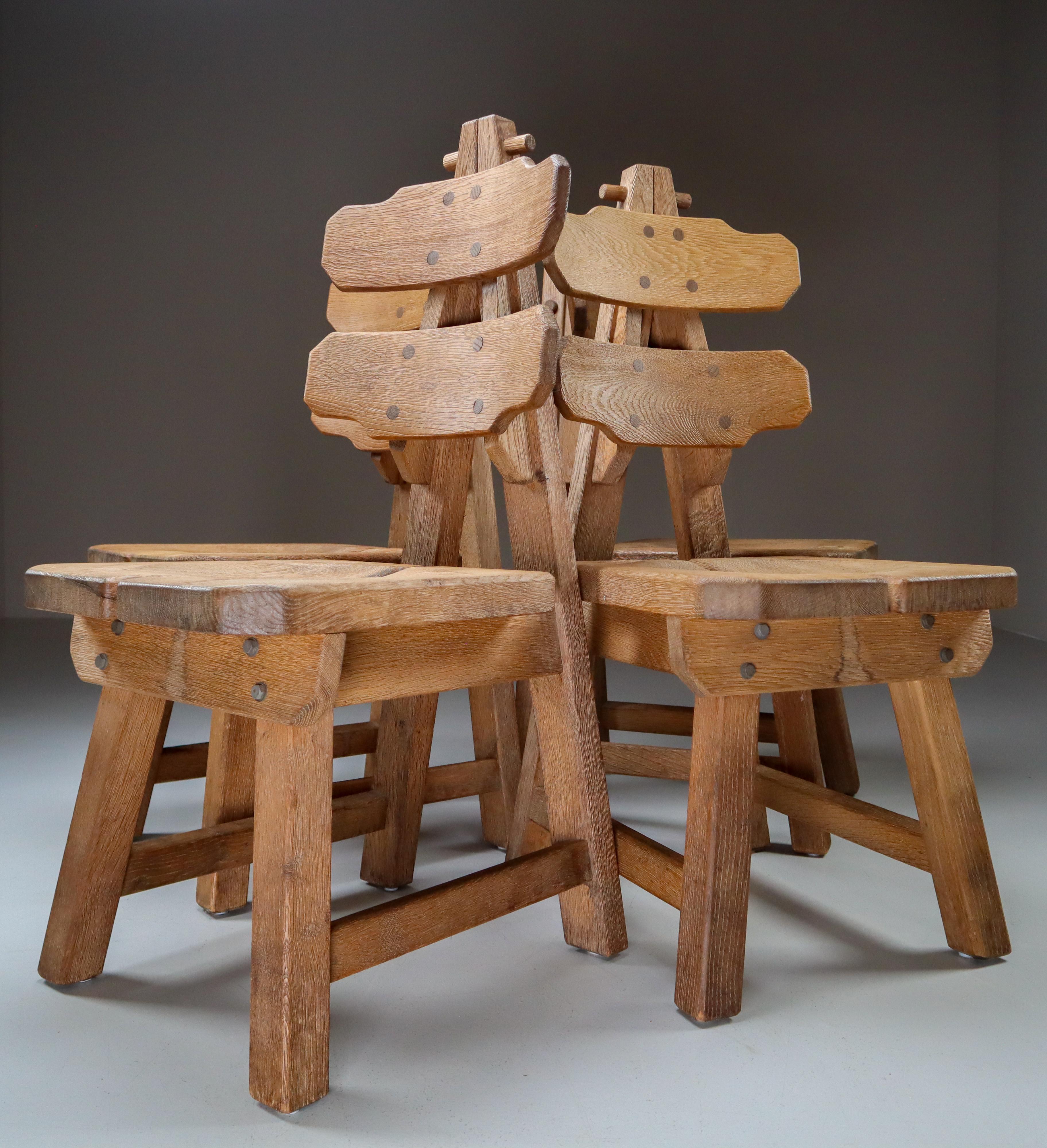 Set of four sculptural chairs in oak, France, 1960s

A robust set of four sculptural wooden dining chairs. These chairs are made of French oak and sculpturally crafted by hand. The craftsmanship is still visible, they are made of solid oak wood