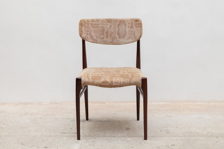 Excellent set of four sculptural walnut dining chairs.Upholstered in original print velvet.The chairs retain their original finish in fabulous vintage condition.