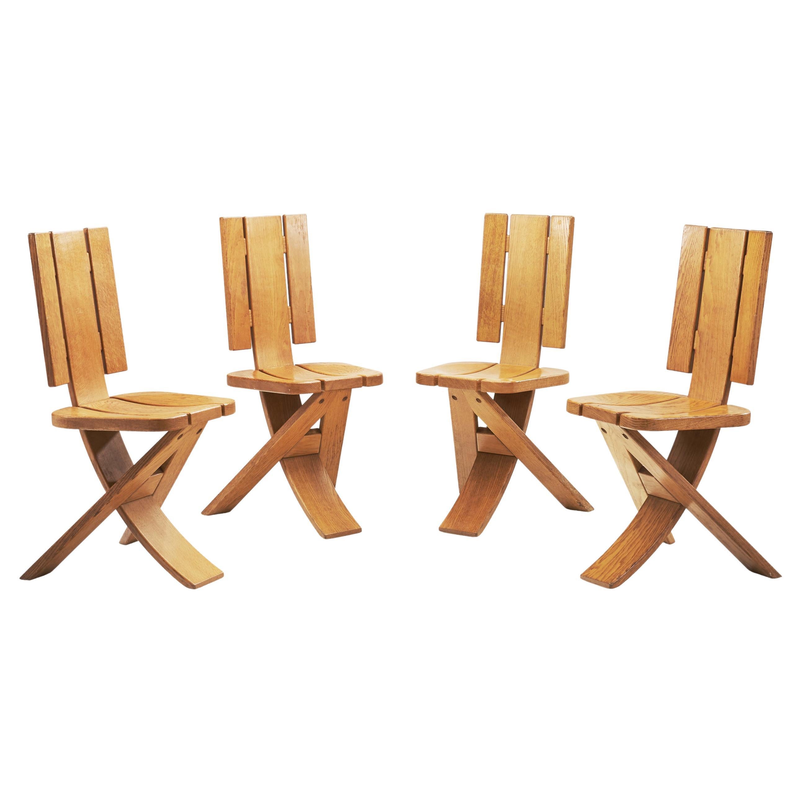 Set of Four Sculptural Oak Tripod Chairs by Ebénisterie Seltz, France, 1970s For Sale