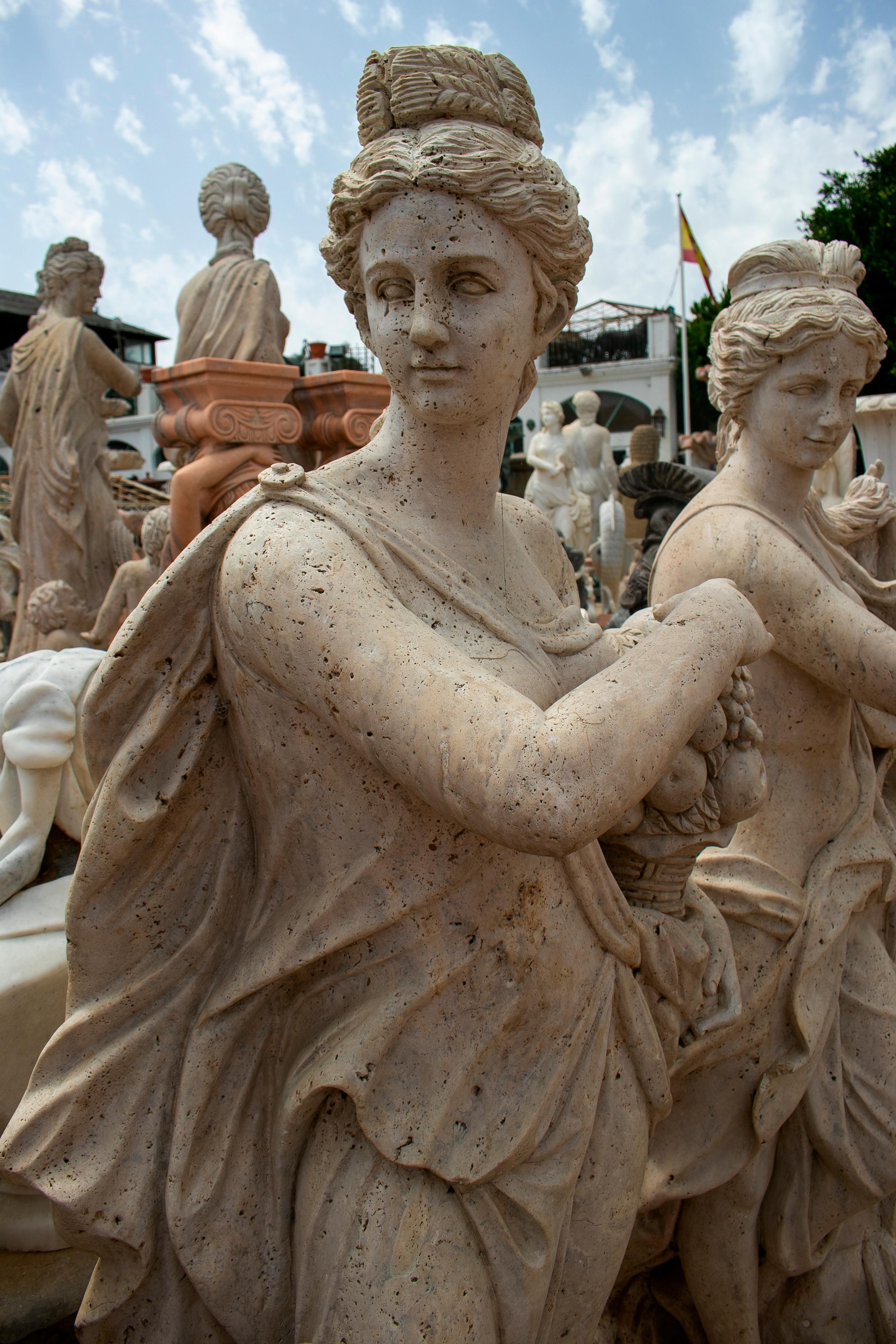 Late 20th Century Set of Four Seasons with Children Hand Carved in Romano Travertine Marble