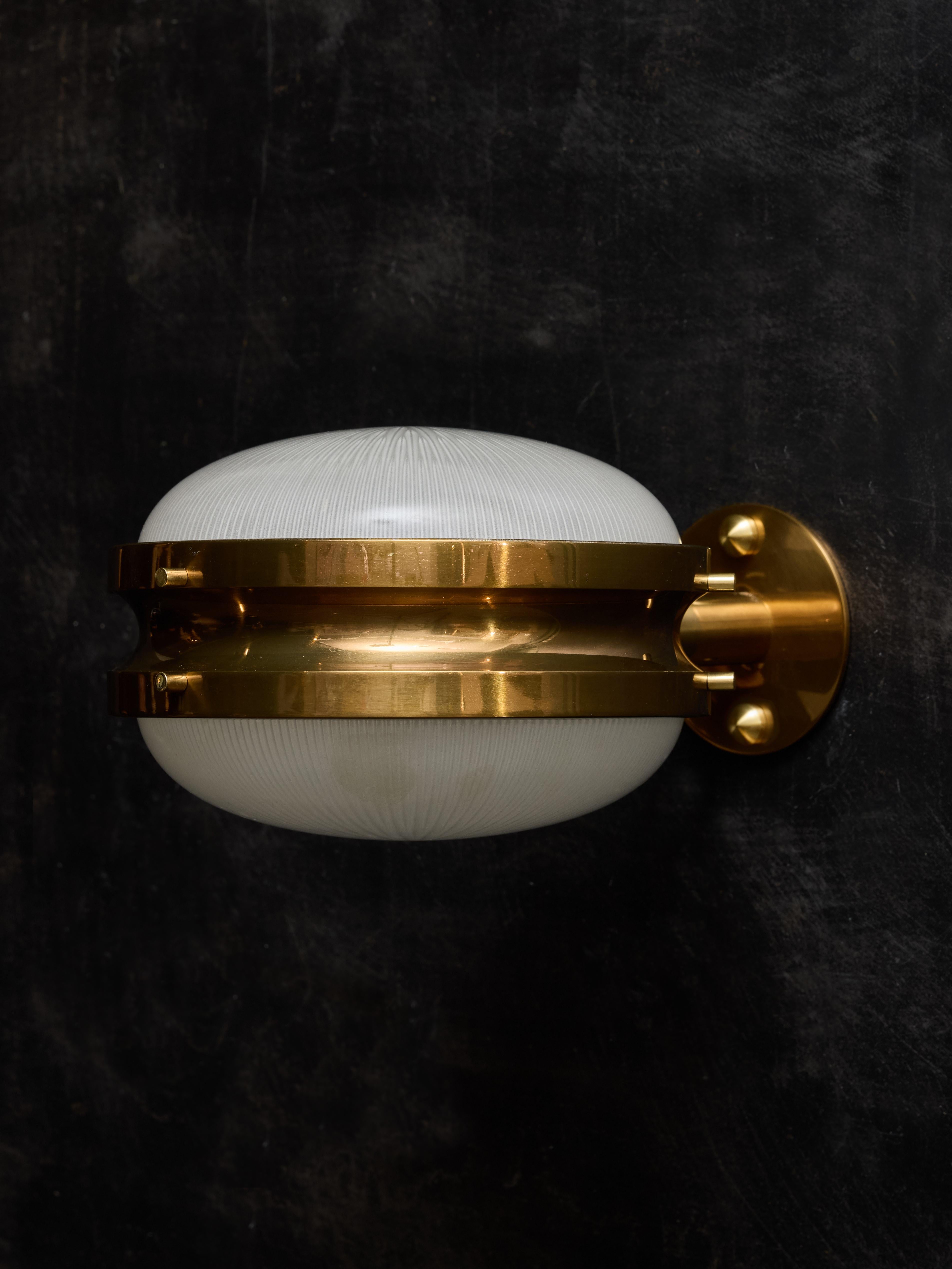 Set of four wall sconces in brass and glass lenses designed by Sergio Mazza for Artemide in the 1960s, called the Gamma.

SERGIO MAZZA

Born in 1931 in Milan, Italy, Sergio Mazza is a renowned Italian designer celebrated for his contributions to