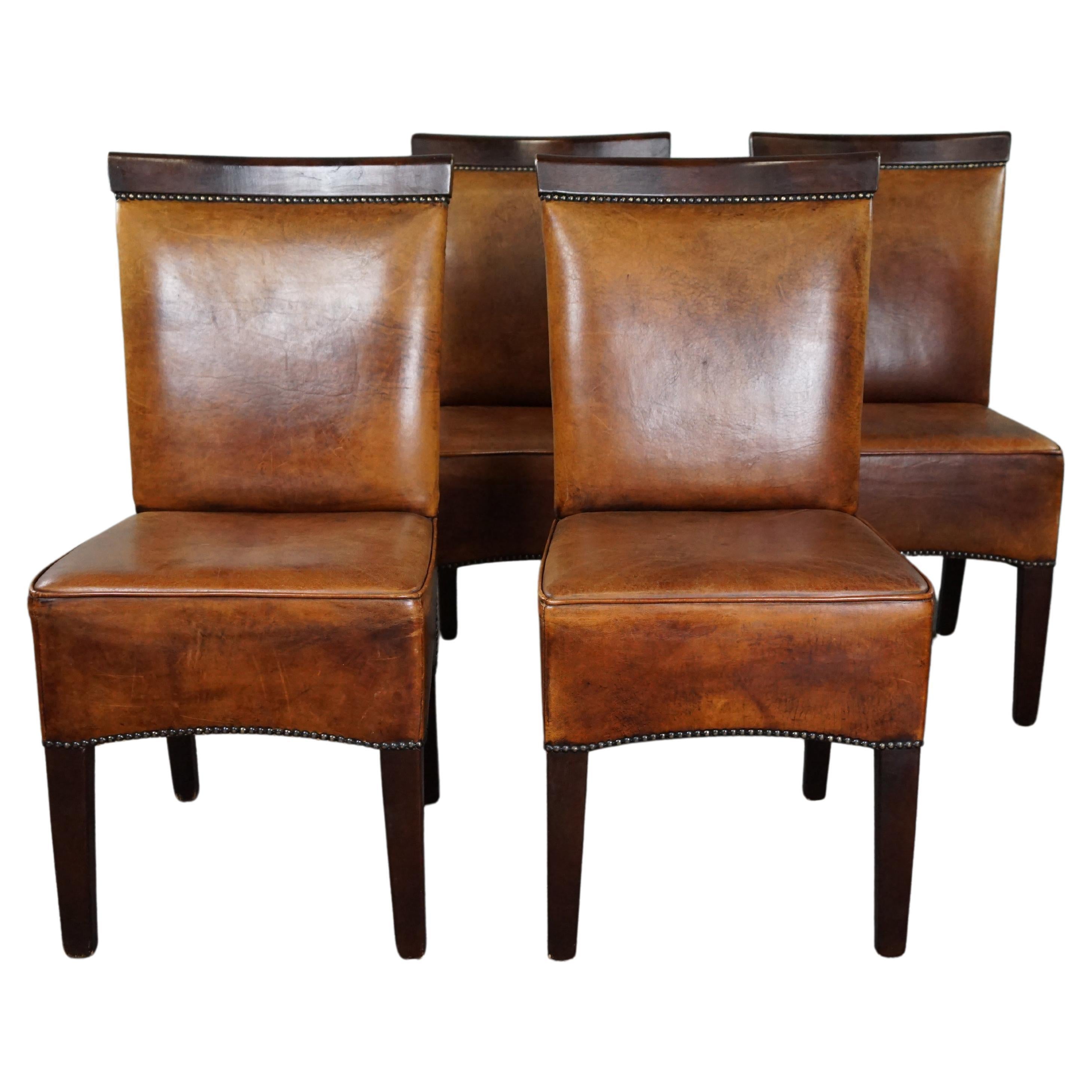 Set of four sheep leather dining chairs in Art Deco style For Sale