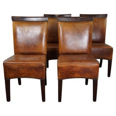 Set of four sheep leather dining chairs in Art Deco style