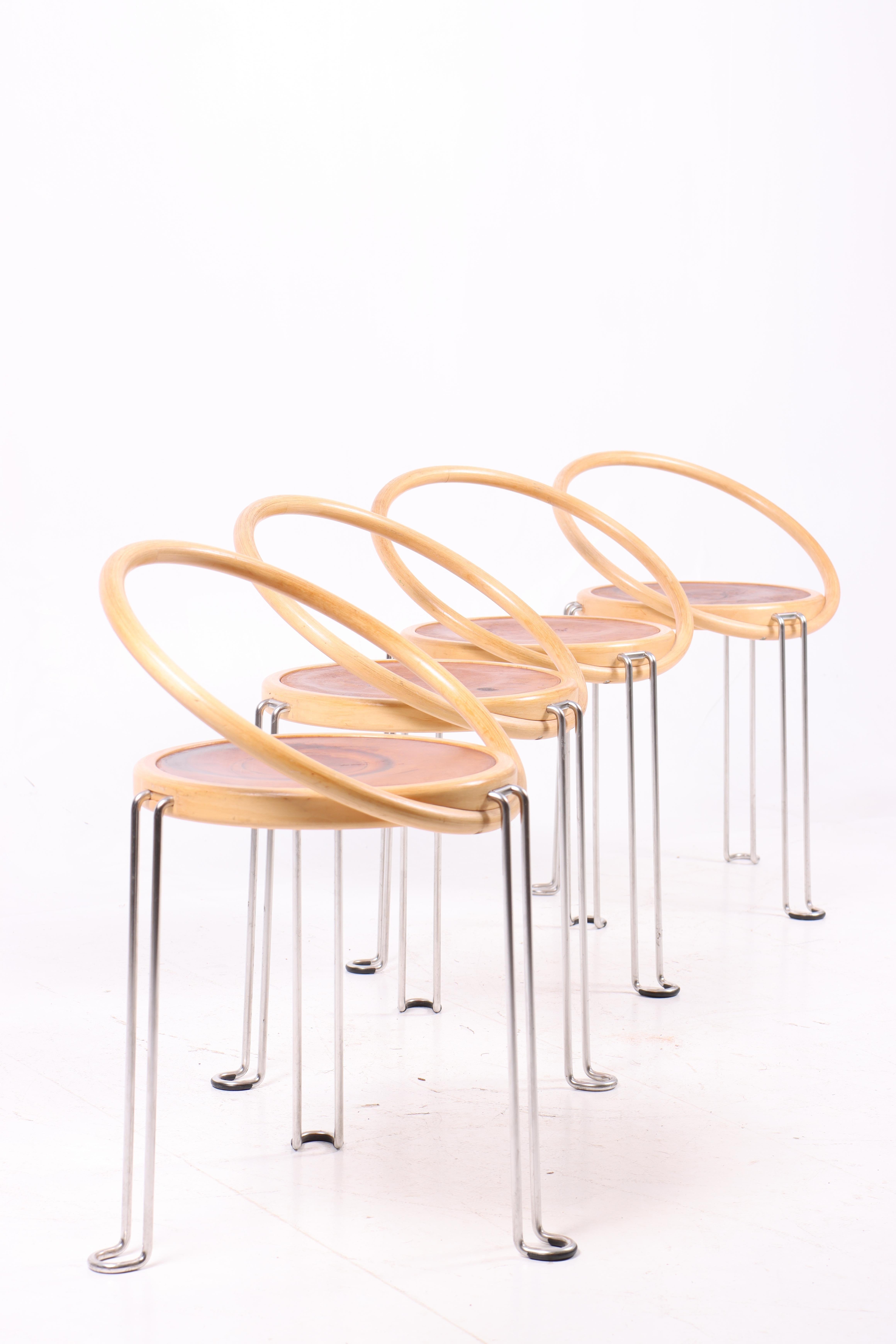Set of four side chairs, in ash wood, leather and chrome frame. Designed by Börge Lindau for Blå Station. Original condition.