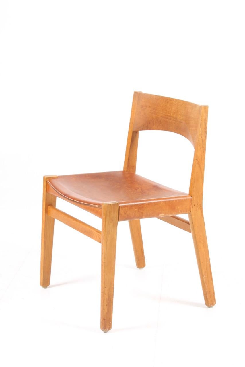 A set of four side chairs in solid oak with original leather seats. Designed by John Vedel-Rieperl for Erhard Rasmussen.

Literature: 4 0 years of Danish furniture design: the Copenhagen Cabinetmakers’ Guild exhibitions 1927-1966 ; Dansk