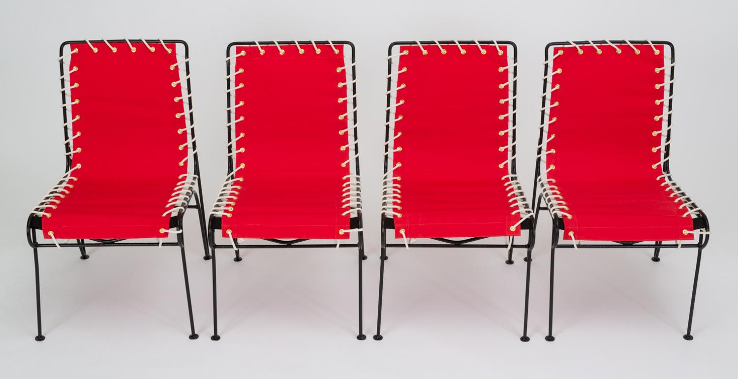 A set of four “Sol-Air” patio side chairs by Pipsan Saarinen Swanson for Ficks Reed Co. The sturdily constructed chair has an angular iron frame mitigated by a curved seat and playful disc feet. Originally marketed as indoor/outdoor furniture for