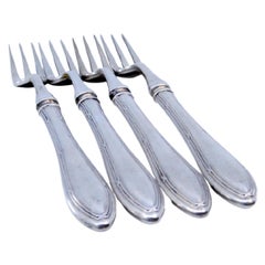 Set of four silver forks with three tines and crimped handles