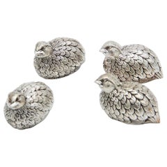 Set of four silver salt and pepper shakers in the shape of partridges