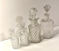 Set of Four Sizes of Swirl Designed Glass Decanters