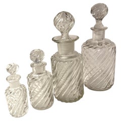 Set of Four Sizes of Swirl Designed Glass Decanters