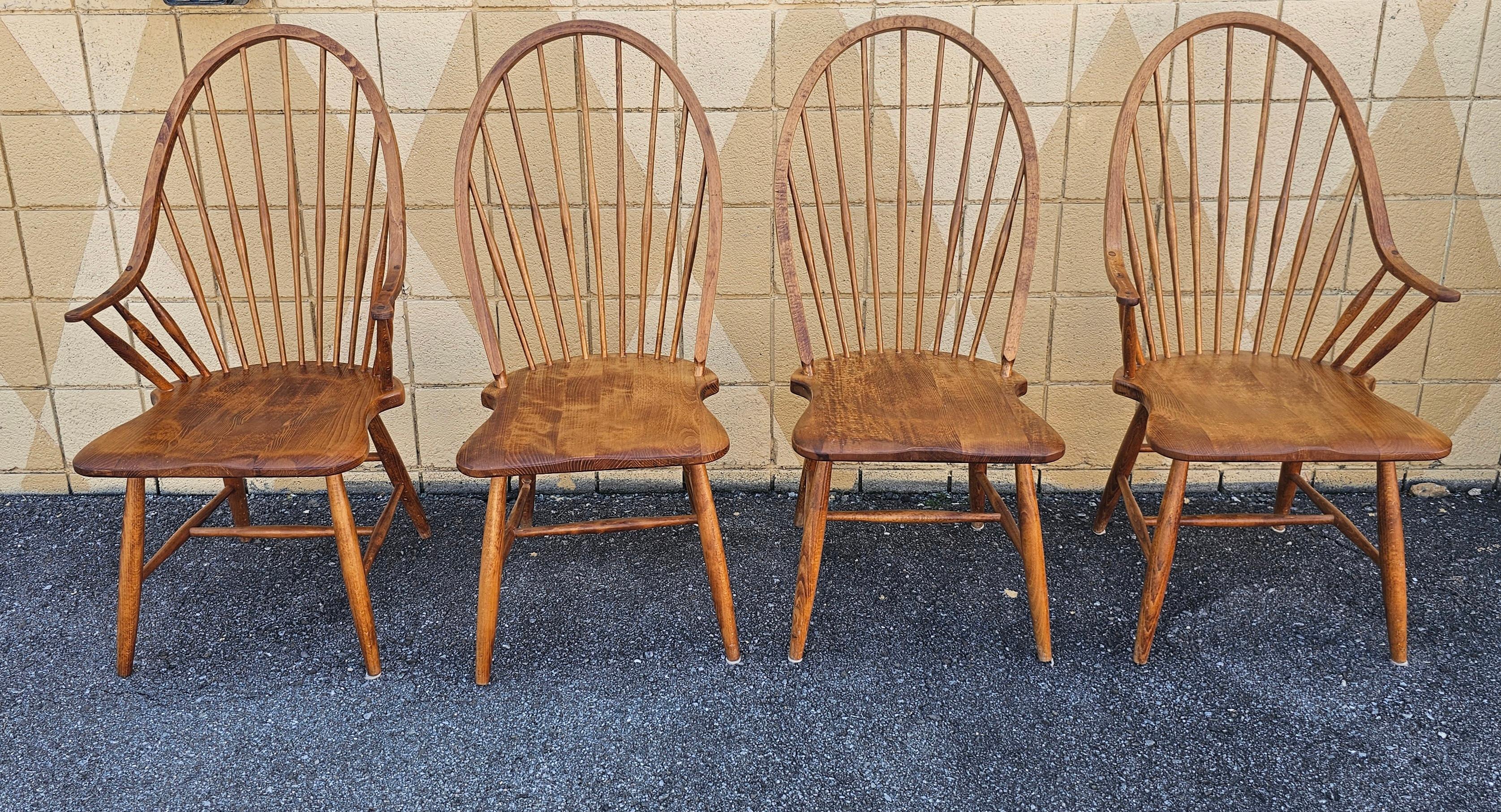 A set two continuous arm and two side Windsor Chairs in  solid red maple with high  barrel back, made in Slovenia. Great vintage condition. Measure 22.5