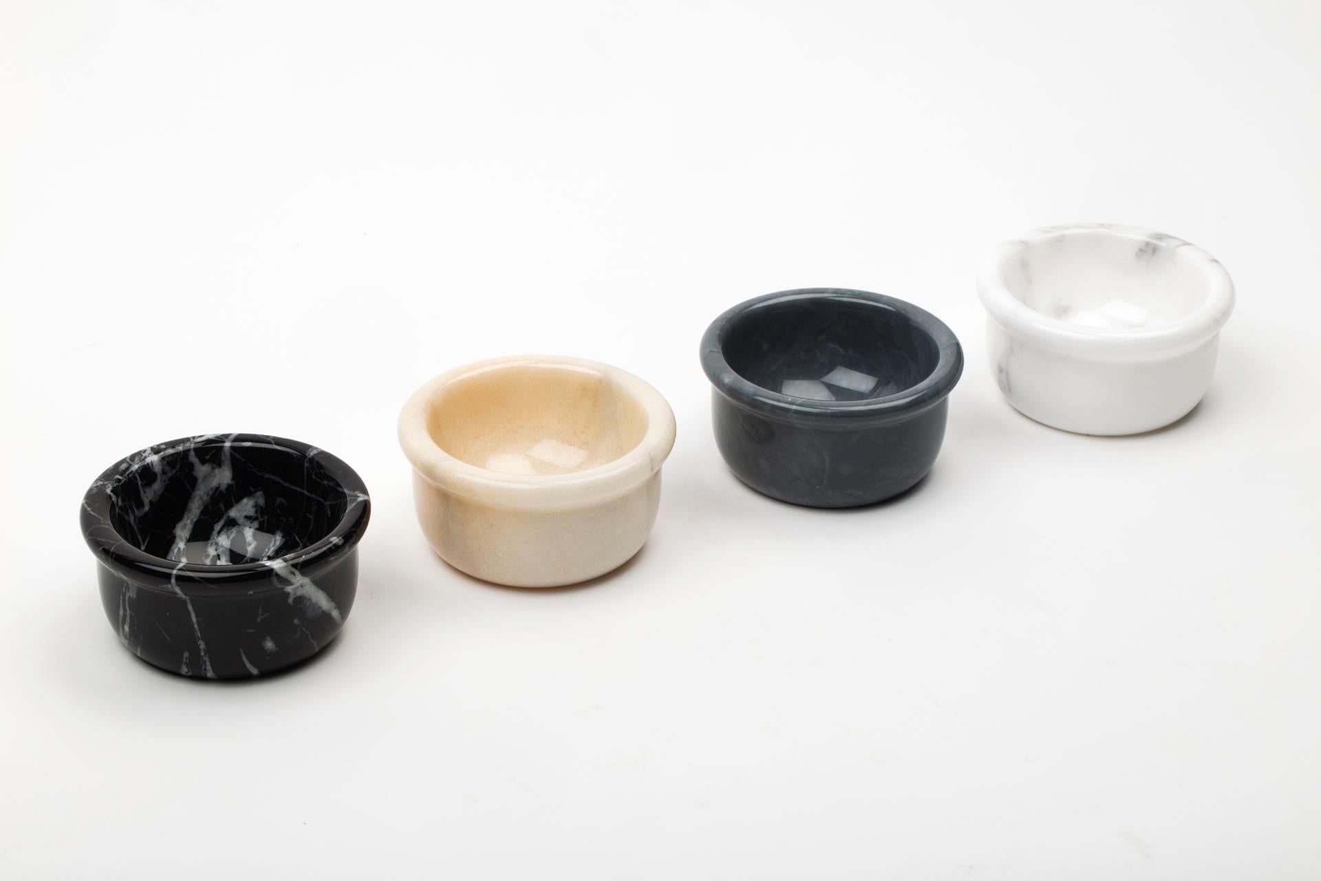 Set of four small bowls in grey, white, black and pink marble. Ideal for serving peanuts, olives and small bites for aperitif in general since certificated for food use. Functional and ideal also for different uses.
Each piece is in a way unique