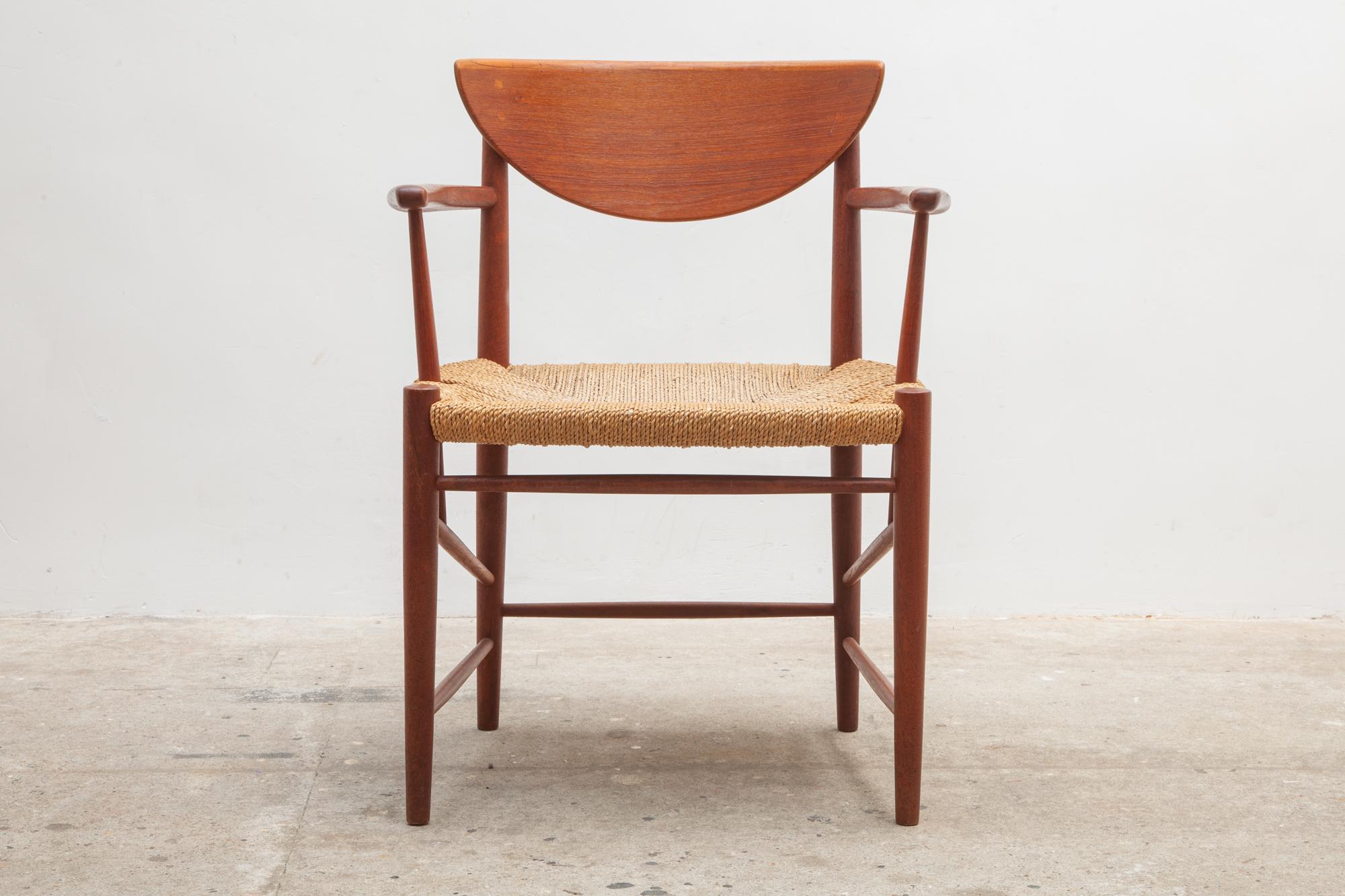 Mid-Century Modern teak dining, side set of four arms chairs in solid teak with sleek spindle legs and woven seats designed in the early 1950s by Peter Hvidt and Orla Mølgaard-Nielsen for the manufacture Soborg Mobler in 1956. Dimensions: Chairs 60