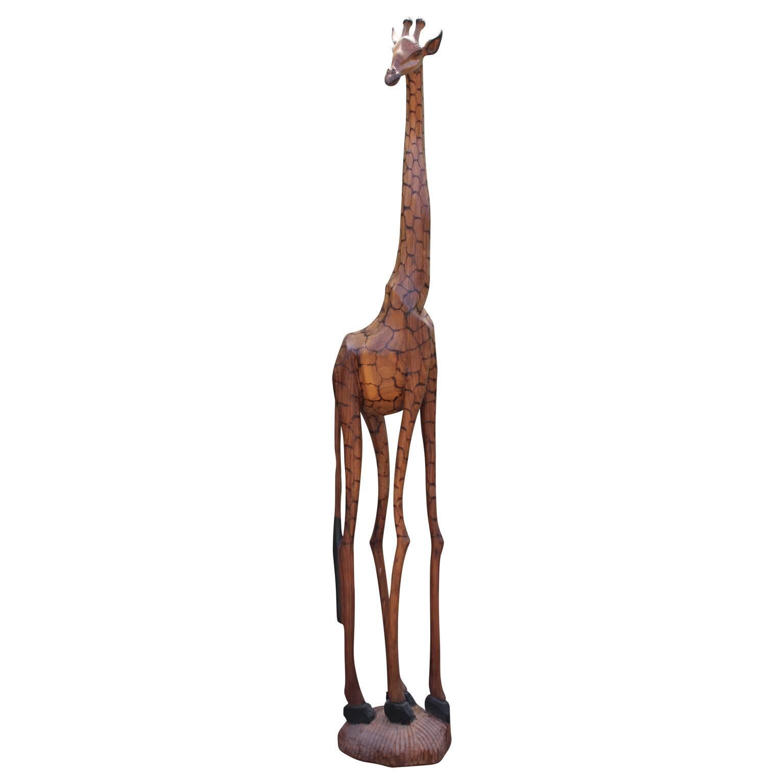 Set of four hand-carved South African giraffe sculptures circa 1970s of various sizes. We are selling as a set of four but if interested in purchasing individually. Dimensions below:

Measures: 1.) 112 in. H x 17 in. W x 17 in. D
2.) 87 in. H x