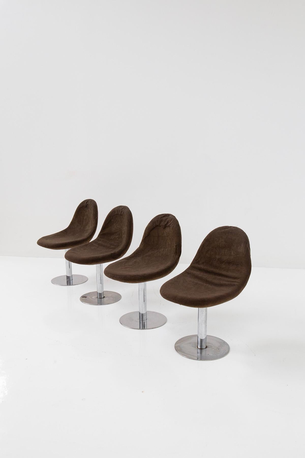 Set of four Space Age Italian chairs dating back to the 1970s is up for grabs. These chairs embody the iconic and enduring Space Age design, epitomizing the era's futuristic aesthetic. Crafted from durable tubular metal, each chair features a