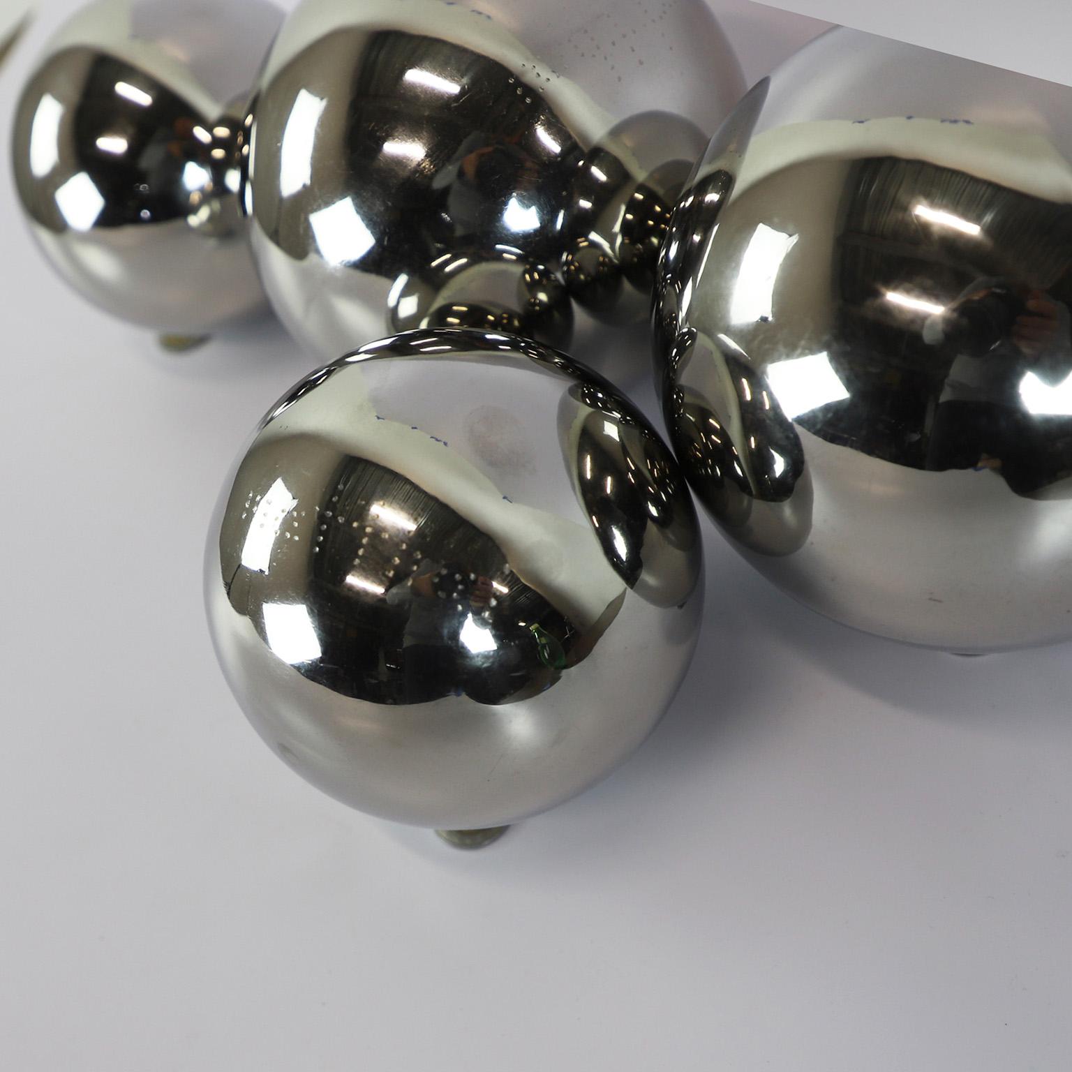 We offer this fantastic set of four spheres circa 1990 chromed metal by Diego Matthai in perfect vintage conditions. The three spheres inscribed 'Mattai'.
