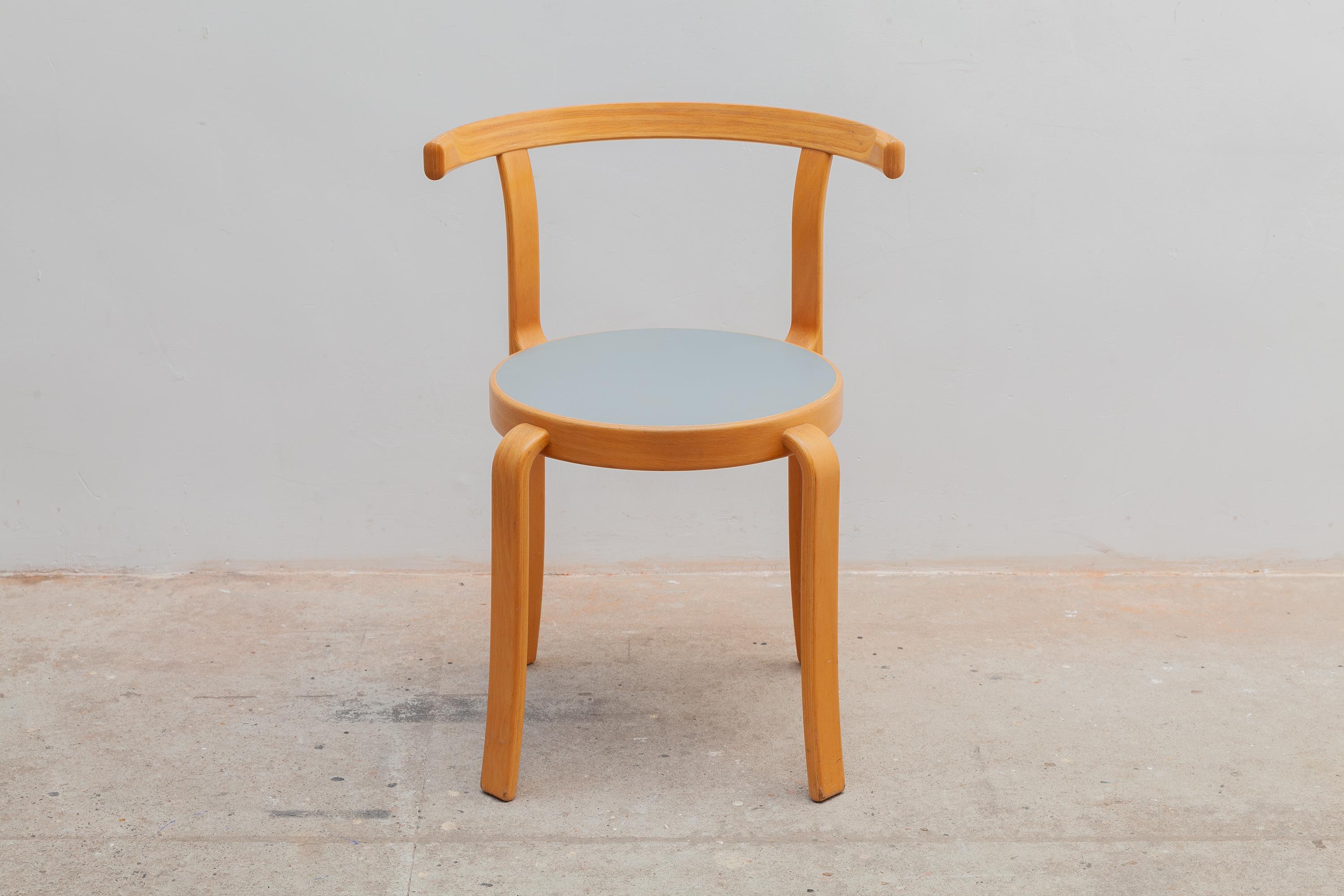 Vintage 8000 series four chairs by Magnus Olsen, Denmark. Stylish curved wooden legs and chair backs with blue-grey top. Vintage patina. Stackable chairs. Dimensions: Chairs: 53 W x 70 H x 44 D cm Seat: 45cm high. Labeled.
