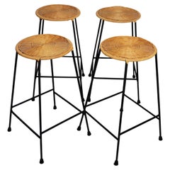 Vintage Set of Four Stacking Counter Stools with Wicker Seats and Black Metal Bases