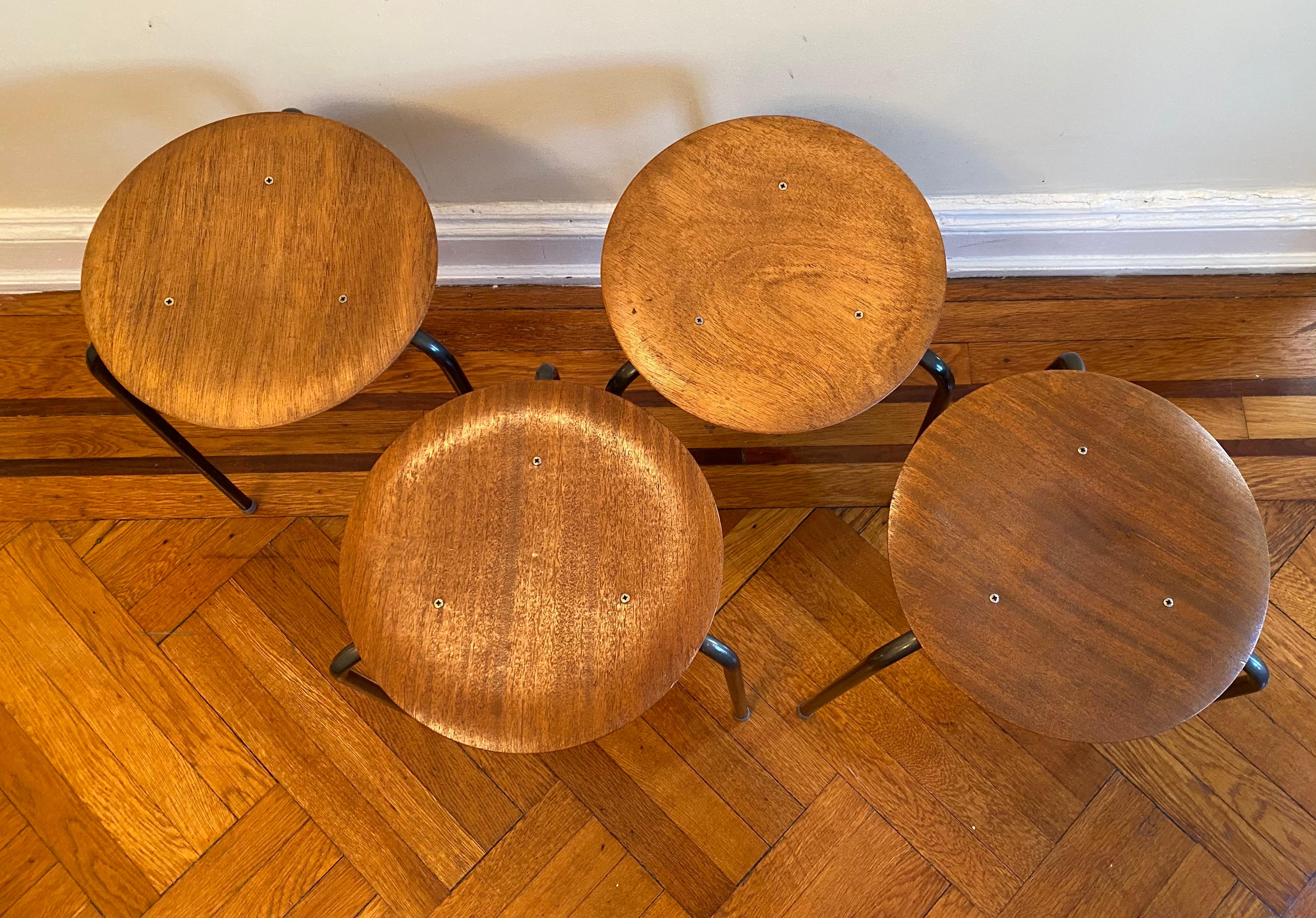 A set of four stool dot teak stacking stools by Arne Jacobsen. Danish, 1950's.