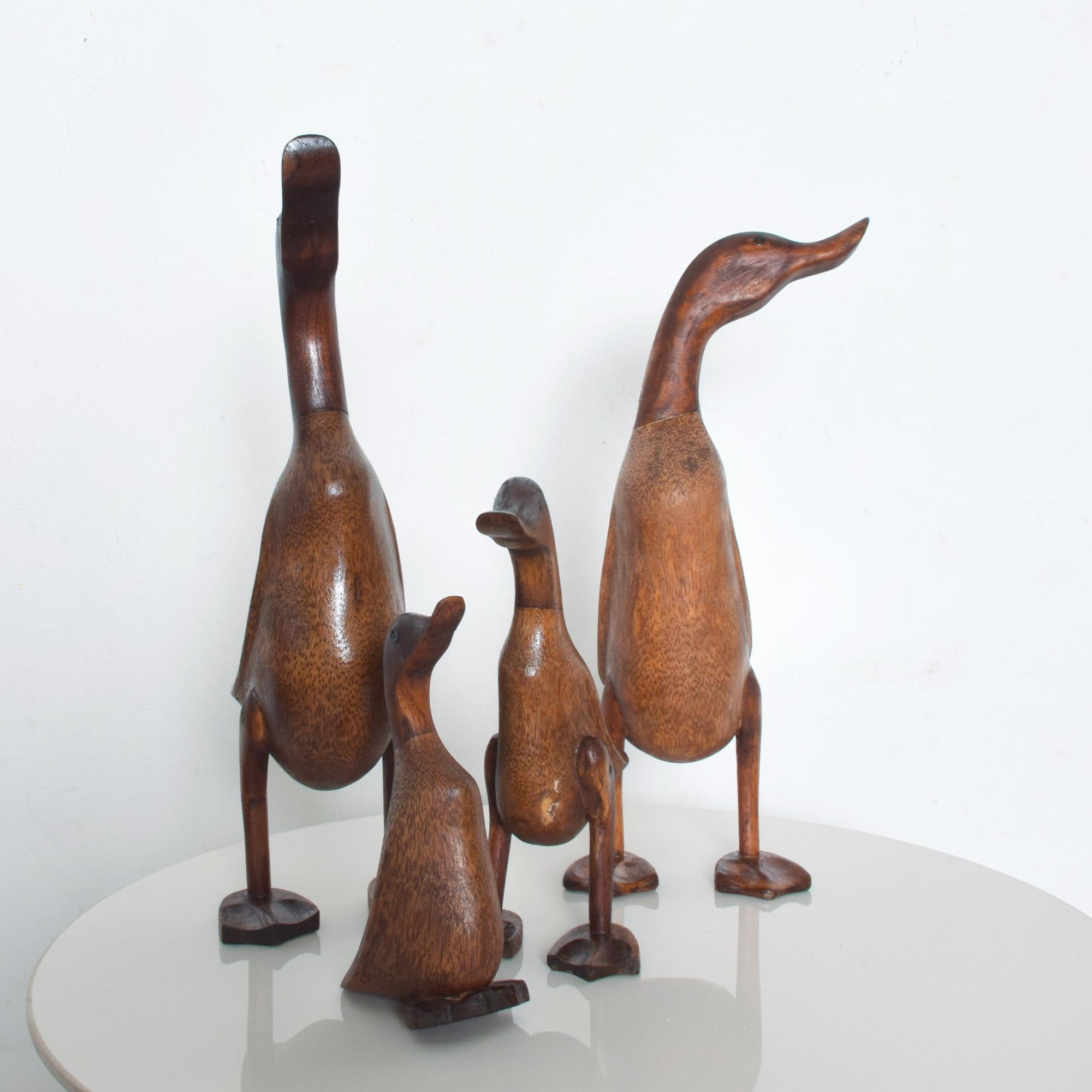 Mid-Century Modern Duck Dynasty USA family of four standing hand carved wood ducks and ducklings statues circa 1950s
Displays beautifully, warm and elegant wood grain. Set includes four wooden ducks.
Unknown information on maker. No stamp