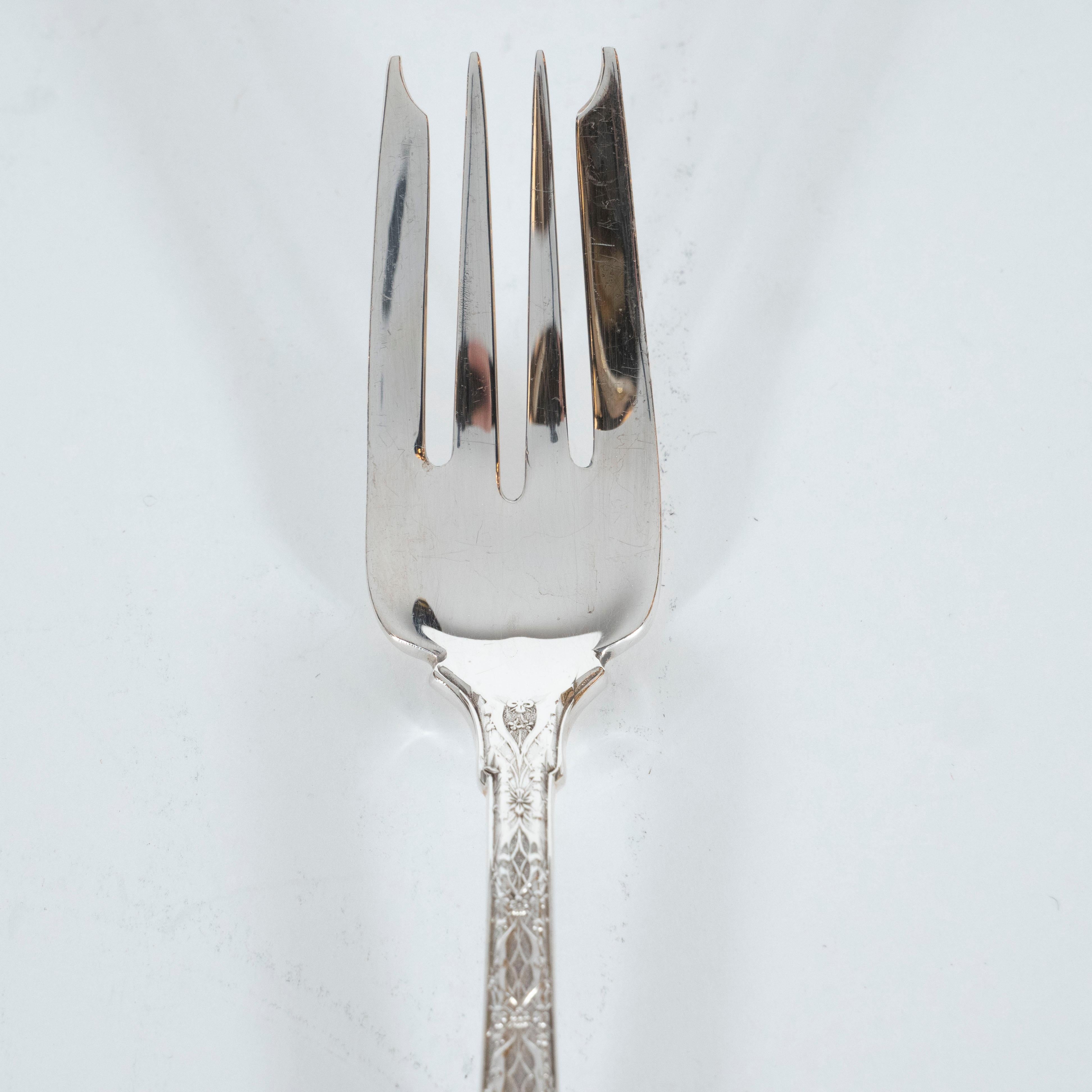 This elegant set of four Mid-Century Modern sterling silver forks were realized by Tiffany & Co.- one of America's premiere luxury makers of the finest silver and precious objects since 1837. Part of their 
