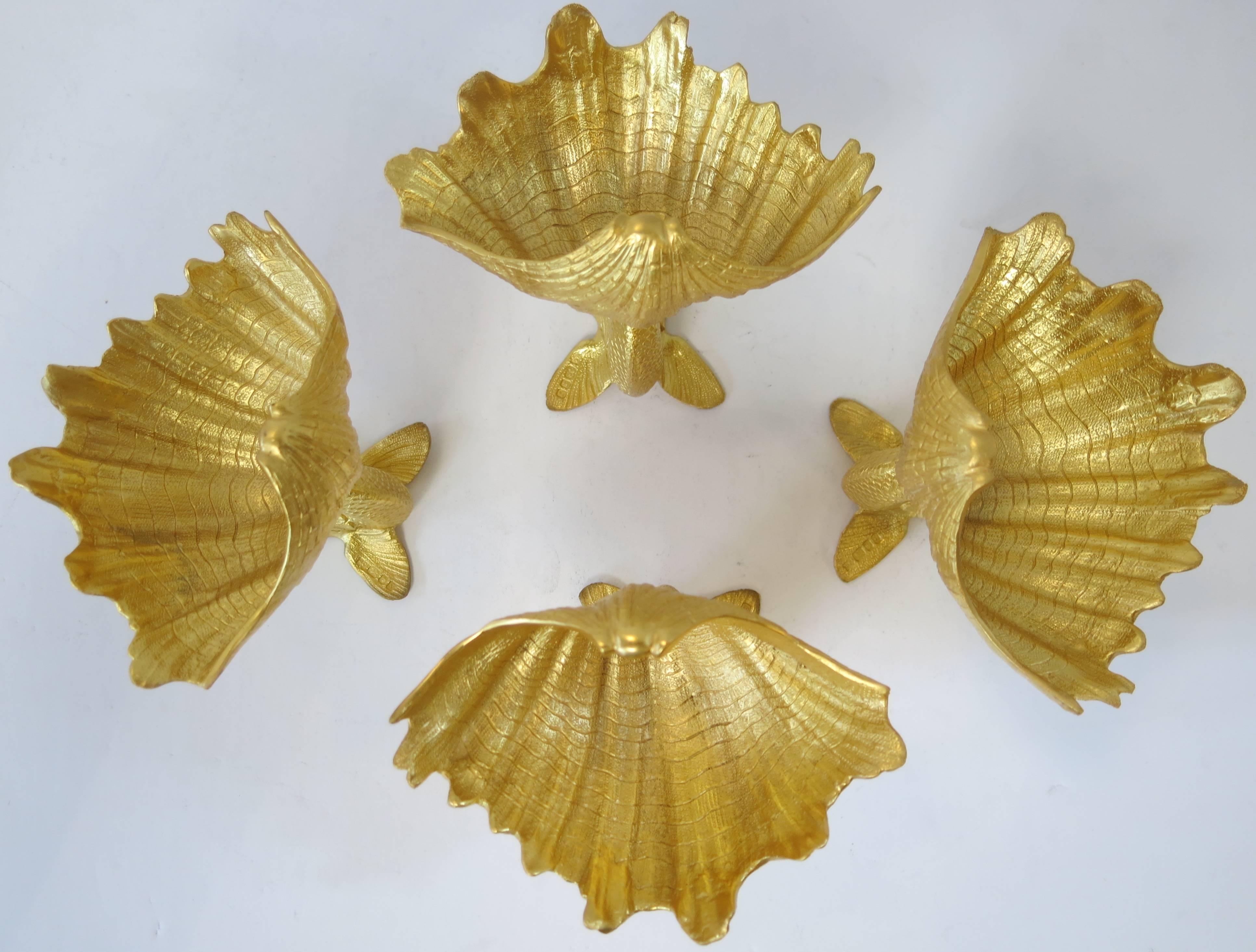 Set of four English, sterling silver gilt, dolphin and shell master salts, made by Richard Comyns, London, 1962. The cast dolphin and shells are beautifully textured and are solid silver.
Each Is Hallmarked. Measure: 4