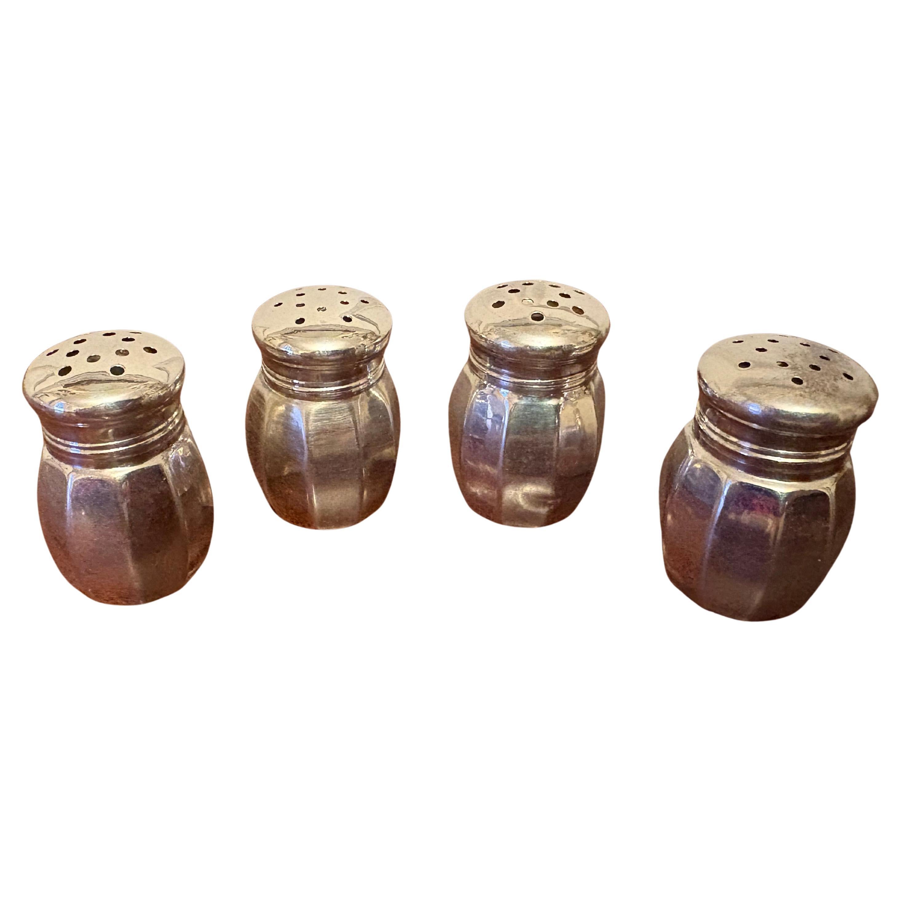Set di quattro saliere e pepiere Reed 
Barton in argento 925, XX secolo