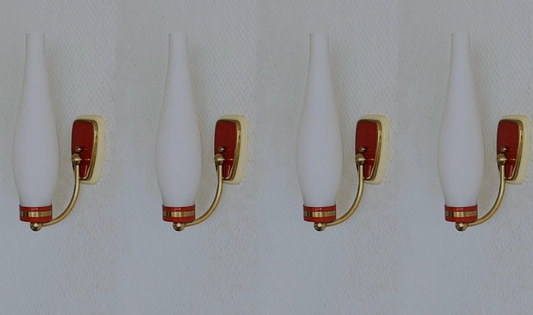 Set of four lovely wall sconces in Stilnovo style, Italy, 1960, modernist and clear lines design, brass galery with opal glass shades - the brass mounts are parcel red enameled. All four sconces in fine vintage condition, no damages, fully