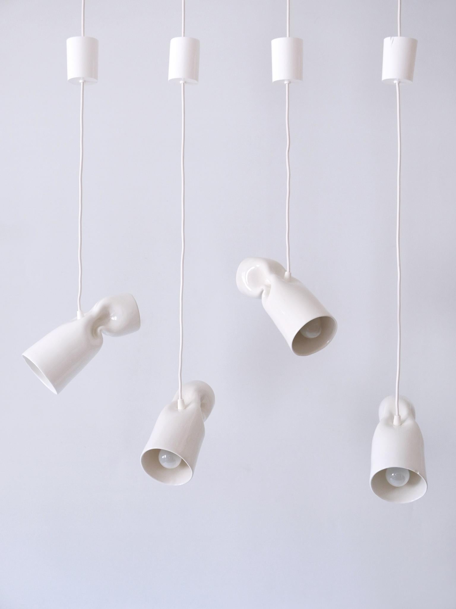 Set of four amazing ceramic pendant lamps 'Strangled lights'. Designed by the German designer Gitta Gschwendtner for Artificial, Germany, 2000s.

Executed in glazed ceramic, each pendant lamp has 1 x E14 / E12 Edison screw fit bulb socket, is wired