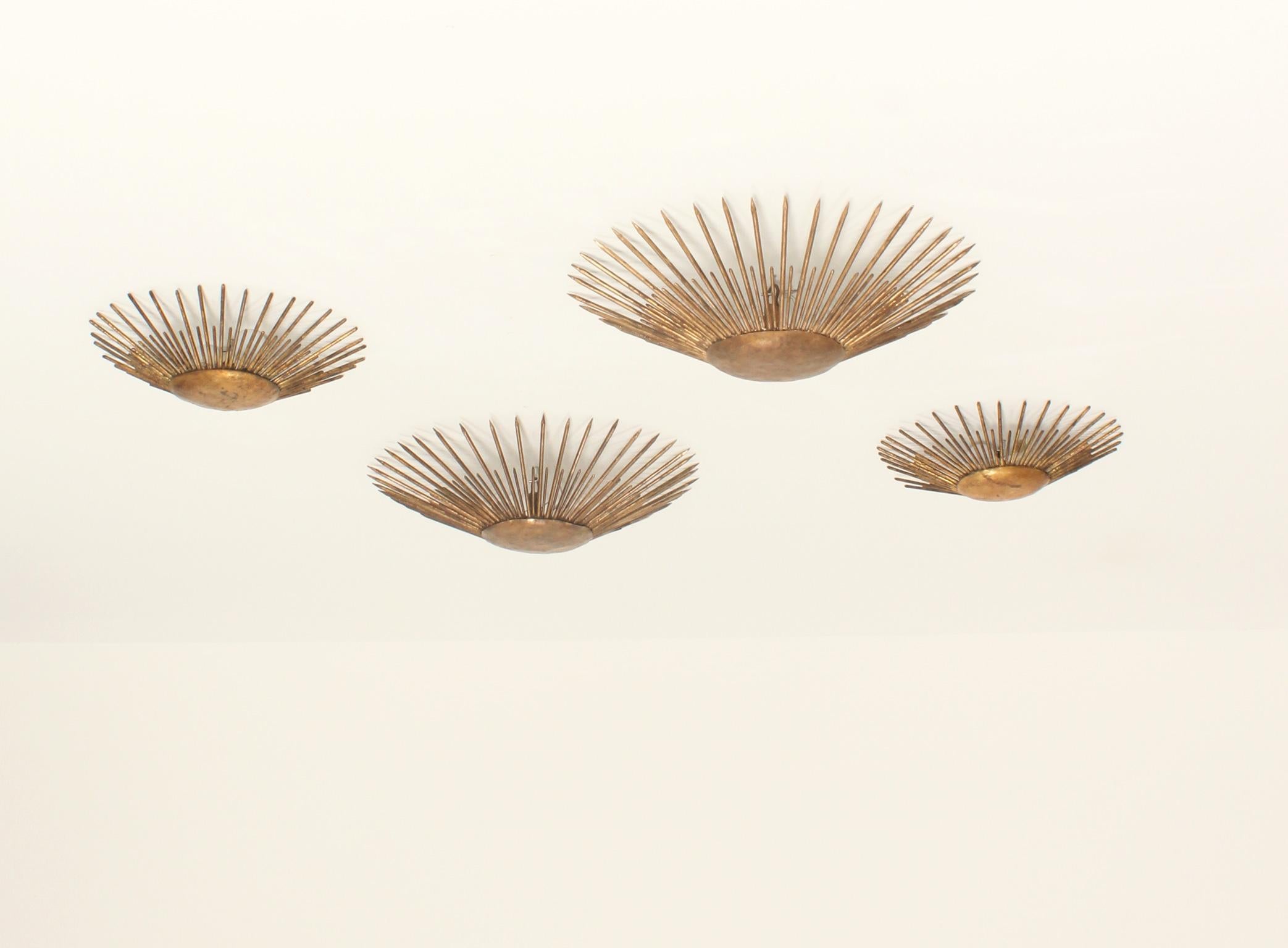 Spanish Set of Four Sunburst Wall or Ceiling Lamps in Gilt Iron, Spain, 1950's For Sale
