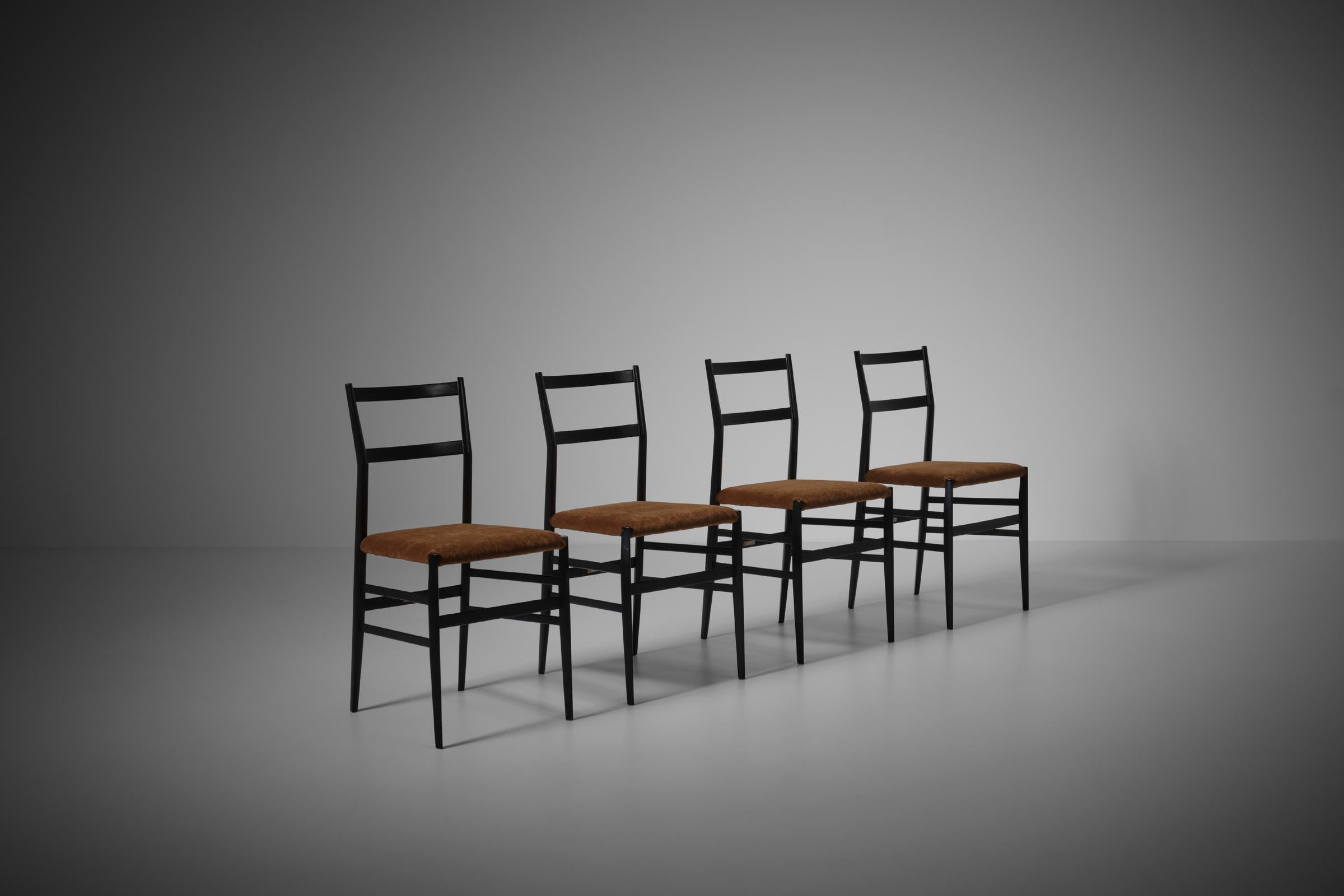 Set of four 'Superleggera' chairs by Gio Ponti for Cassina, Italy 1950s. Iconic design made in solid Ash and their original black lacquered finish and upholstered seat. The seat is reupholstered in a warm honey colored mohair velvet. Characteristic