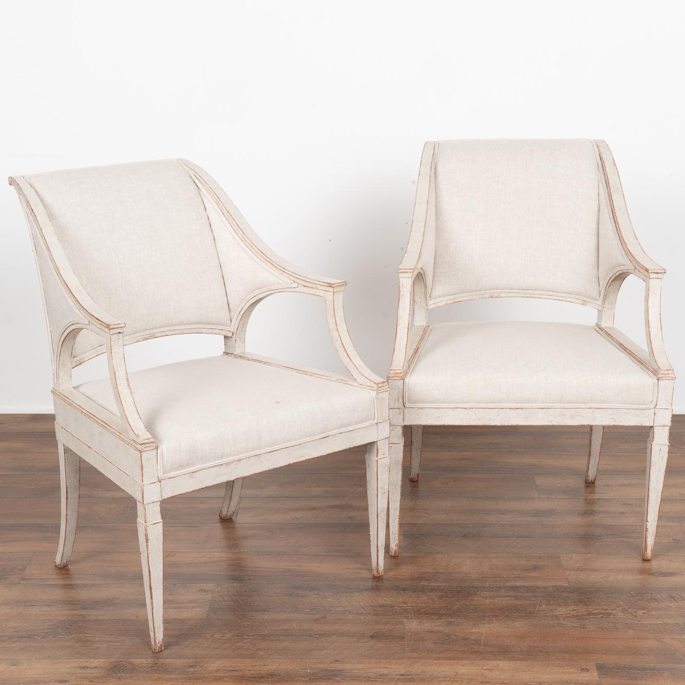Linen Set of Four Swedish Gustavian White Painted Arm Chairs, circa 1820-40