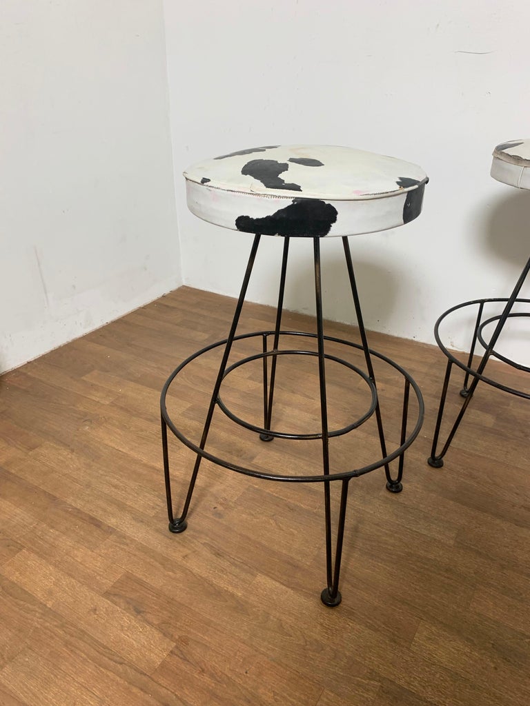 Set of four swivel bar stools circa 1950s, attributed to Frederick Weinberg.
Seat diameter is 15.5