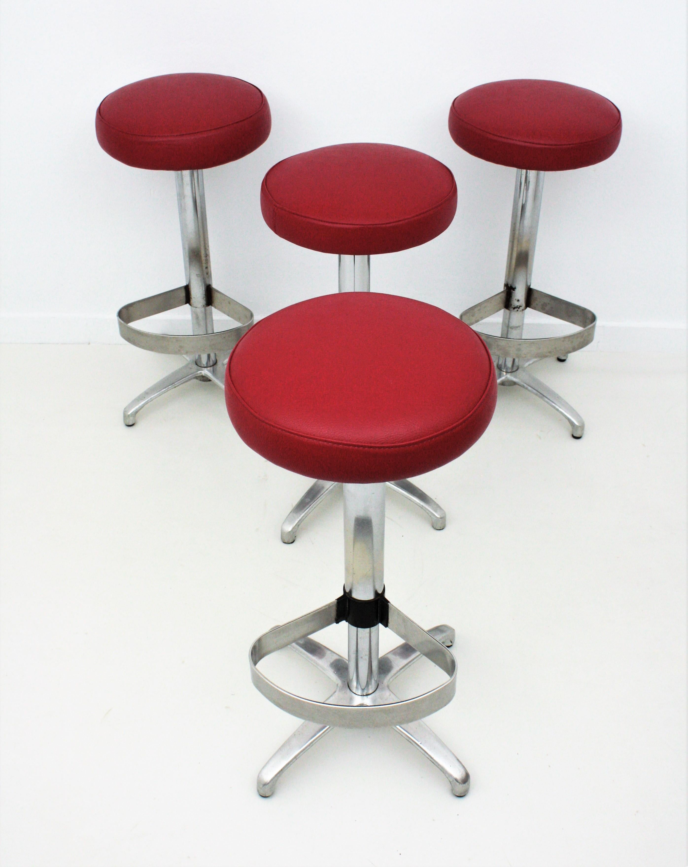 Spanish Four Midcentury Bar Stools in Metal Upholstered in Red Leatherette For Sale