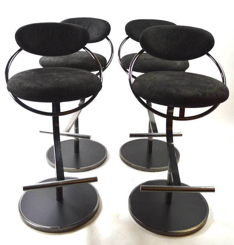 Groovy Postmodern swivel stools manufactured by Design Institute of America, All are in very good, original condition, clean and ready to use. Hard to find sets of four still together, priced and selling as a set. Measures: Seat H 30 inches x foot