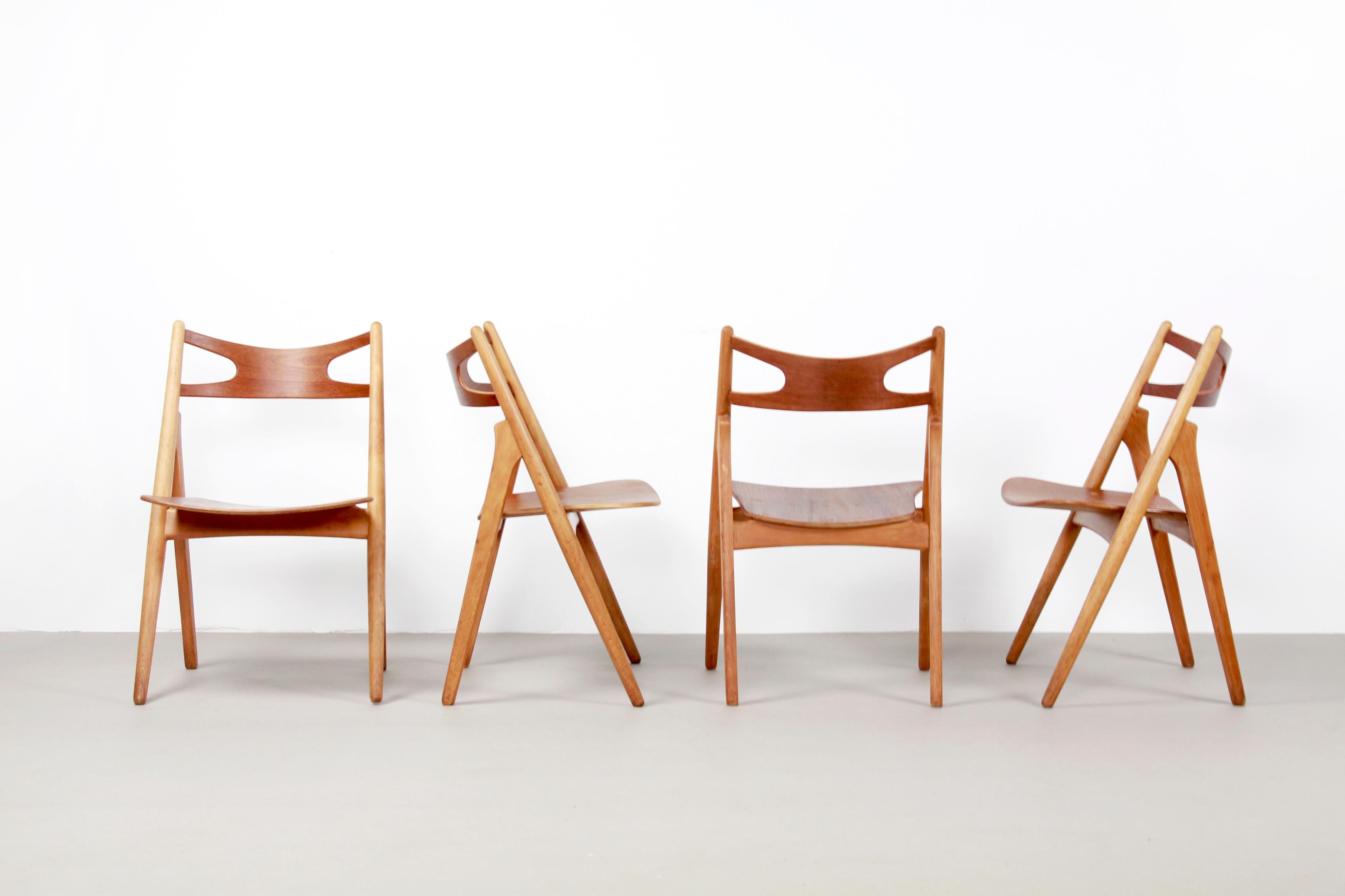 Scandinavian Modern Set of Four Teak Hans J Wegner Sawbuck Model CH29 Chairs by Carl Hansen