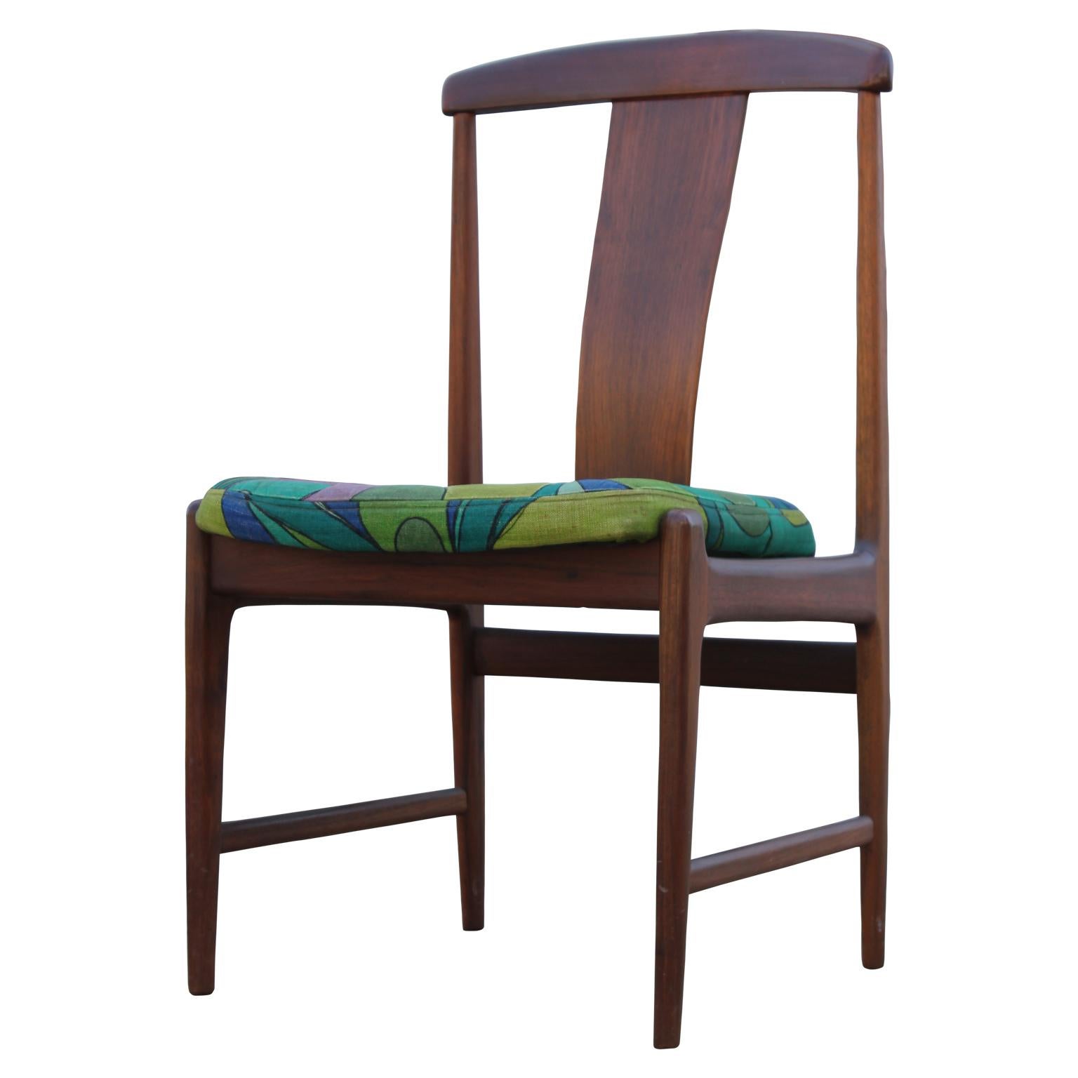 Set of four beautiful Mid-Century Modern dining chairs. They're by Folke Ohlsson for DUX and made from teak. The seat cushions can be reupholstered with COM.
