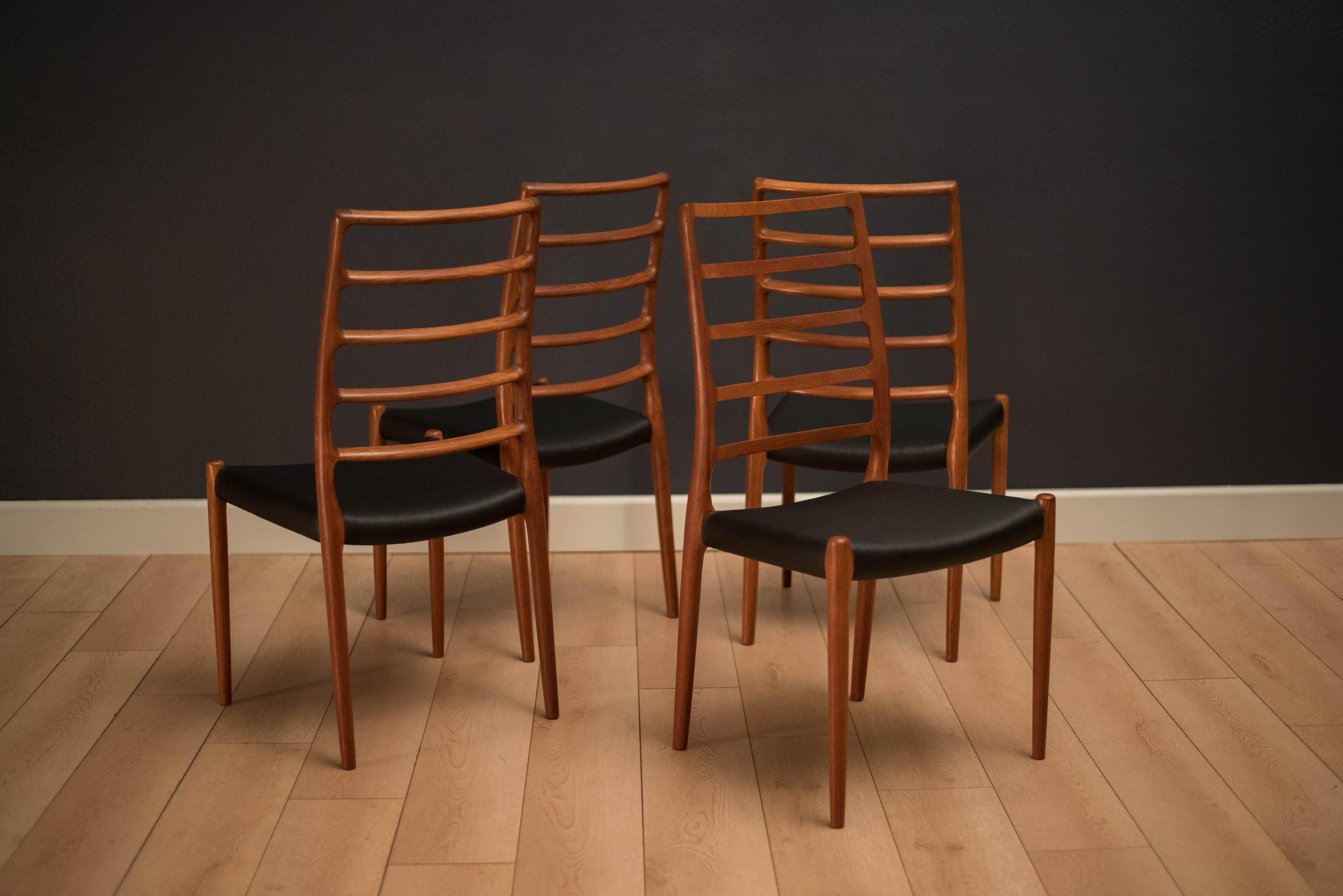 Danish Niels Otto Møller dining chairs model no. 82 in teak. This set of four displays sculpted high back teak frames and newly reupholstered black leatherette seats. Price is for the set of four chairs. 
 


Offered by Mid Century Maddist