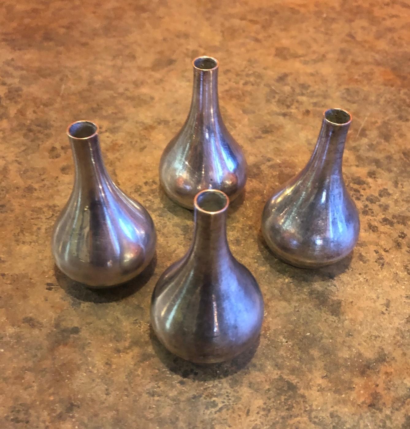 Set of four tear drop candleholders by Jens Quistgaard for Dansk, circa 1960s. They are made in France of silver plate over metal and support a .25