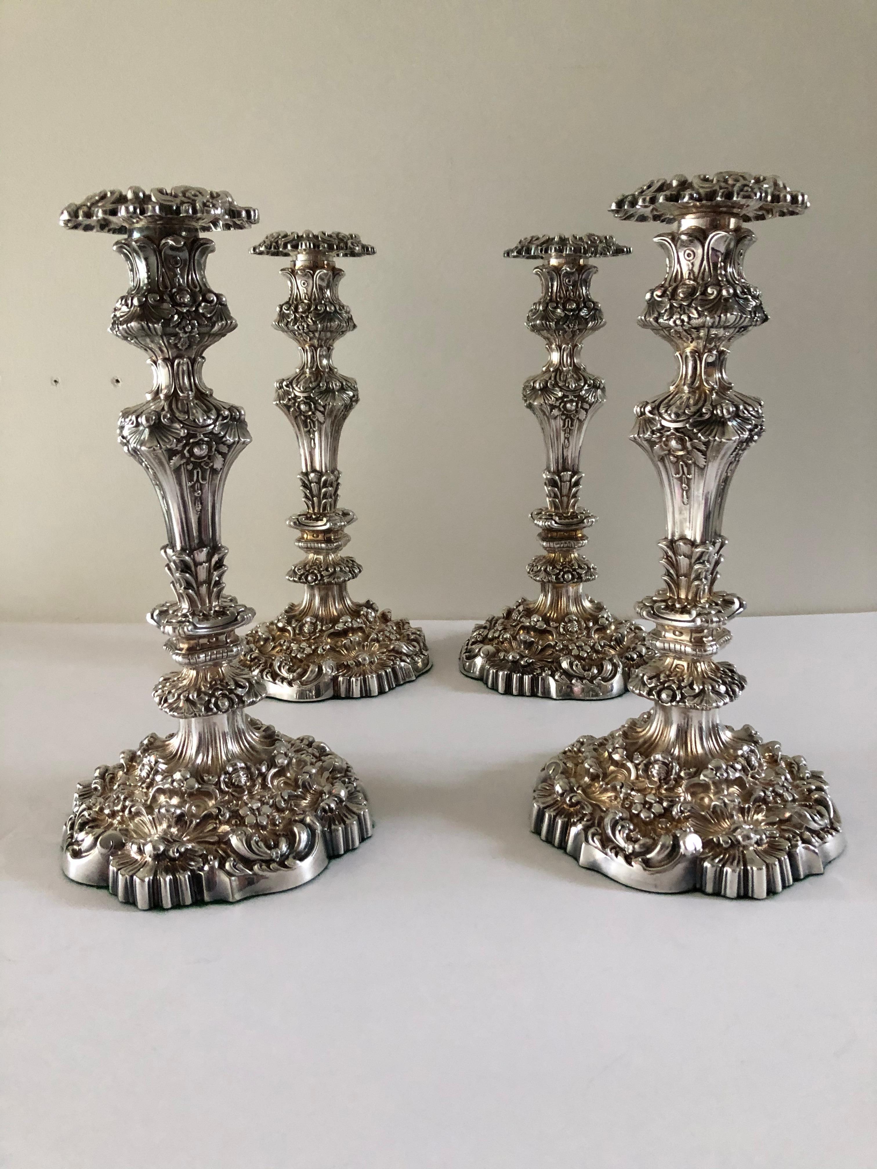 Set of four antique Thomas Bradbury Sheffield repose Rococo revival candlestick, top bobeche's marked inside sticks numbered .Heavy weighted they are stamped with the hallmarks TB co, felt bottoms.