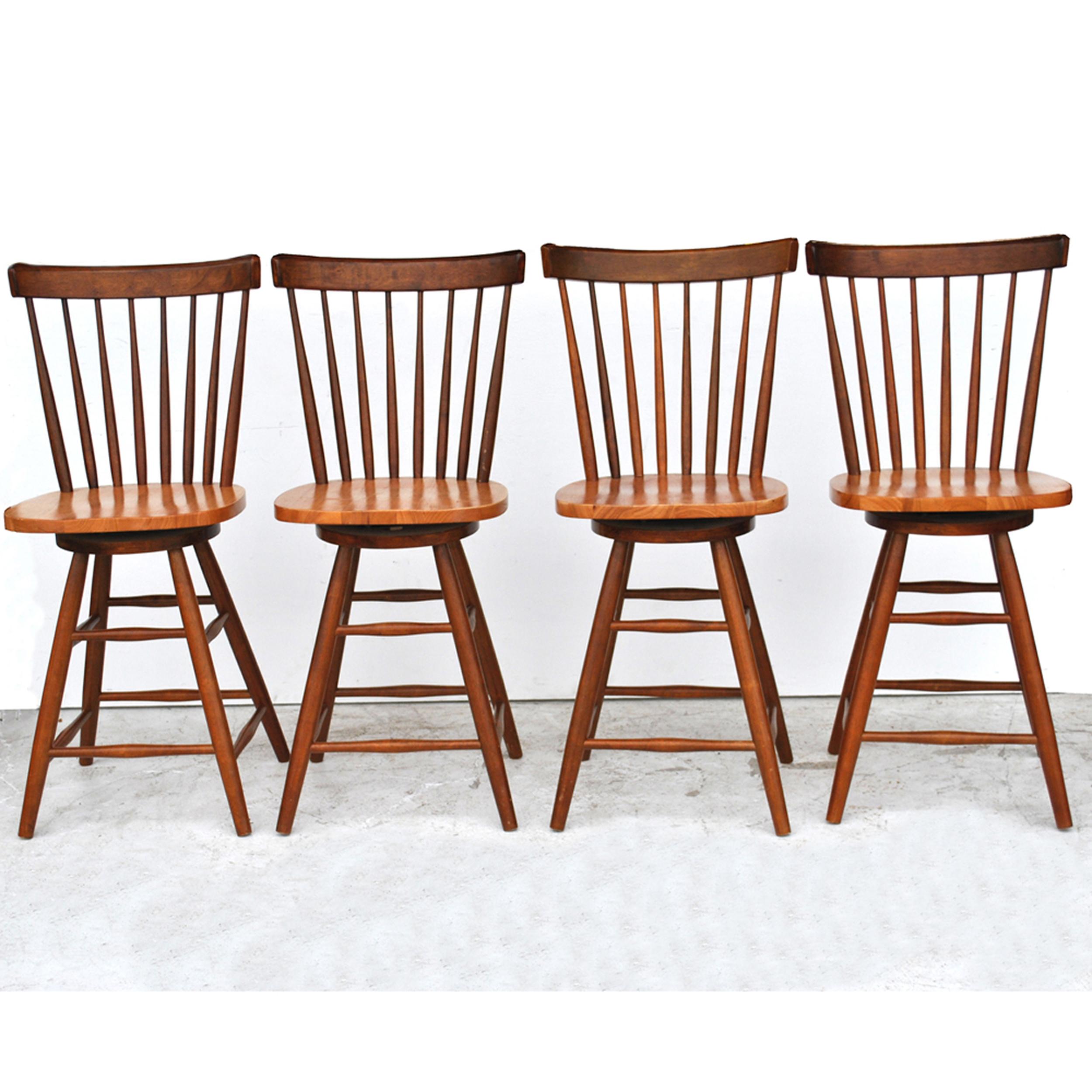 Thomasville Furniture is 

Set of four 42' Thomasville teak counter height stools
A clean, modern version of a traditional stool.
Rich teak with spindle backs. Swivel mechanism.
24.5