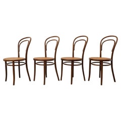 Set of Four Thonet Bent Wood Bistro Chairs by Radomsko, Cane Seats